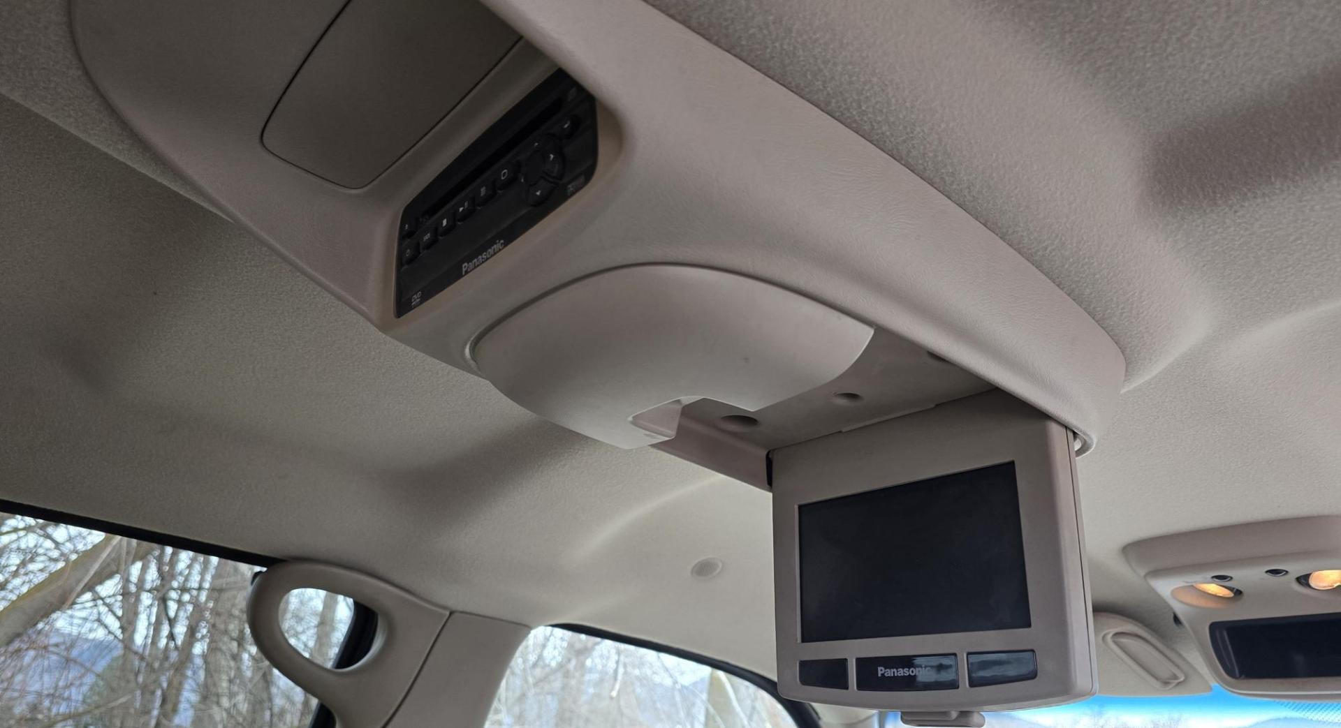 2004 Maroon /Tan Chevrolet Silverado 1500 LS Crew Cab 4WD (2GCEK13T741) with an 5.3L V8 OHV 16V engine, 4-Speed Automatic Overdrive transmission, located at 450 N Russell, Missoula, MT, 59801, (406) 543-6600, 46.874496, -114.017433 - Strong Running 4WD Chevy. 5.3L V8 Engine. Automatic Transmission. Heated Leather Power Front Seats. Rear DVD Player. Power Windows and Locks. AM FM CD Player.Running Boards. Has a check engine light saying there is a misfire but the truck runs great. Does have a Branded Title because the State of Mo - Photo#9