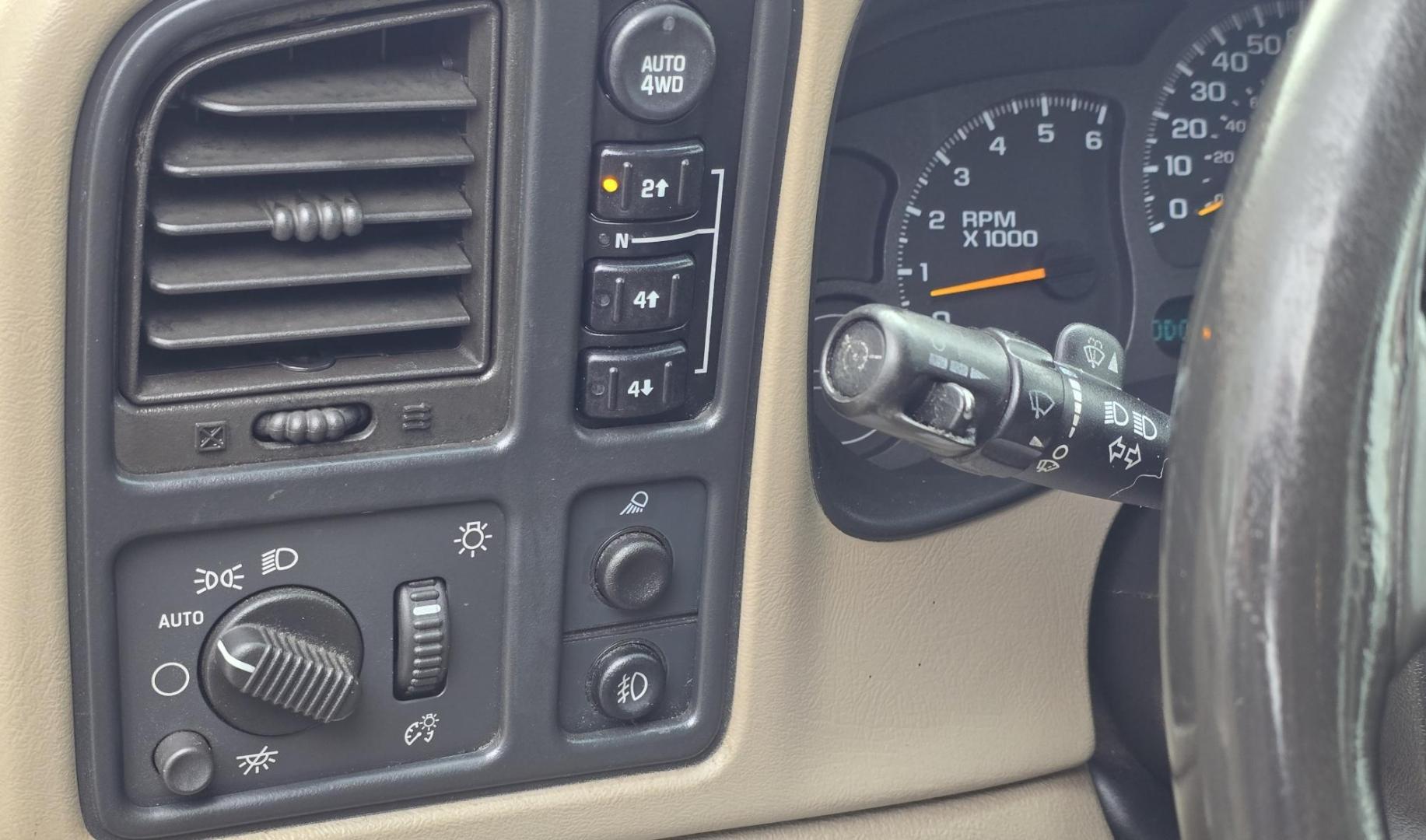 2004 Maroon /Tan Chevrolet Silverado 1500 LS Crew Cab 4WD (2GCEK13T741) with an 5.3L V8 OHV 16V engine, 4-Speed Automatic Overdrive transmission, located at 450 N Russell, Missoula, MT, 59801, (406) 543-6600, 46.874496, -114.017433 - Strong Running 4WD Chevy. 5.3L V8 Engine. Automatic Transmission. Heated Leather Power Front Seats. Rear DVD Player. Power Windows and Locks. AM FM CD Player.Running Boards. Has a check engine light saying there is a misfire but the truck runs great. Does have a Branded Title because the State of Mo - Photo#12