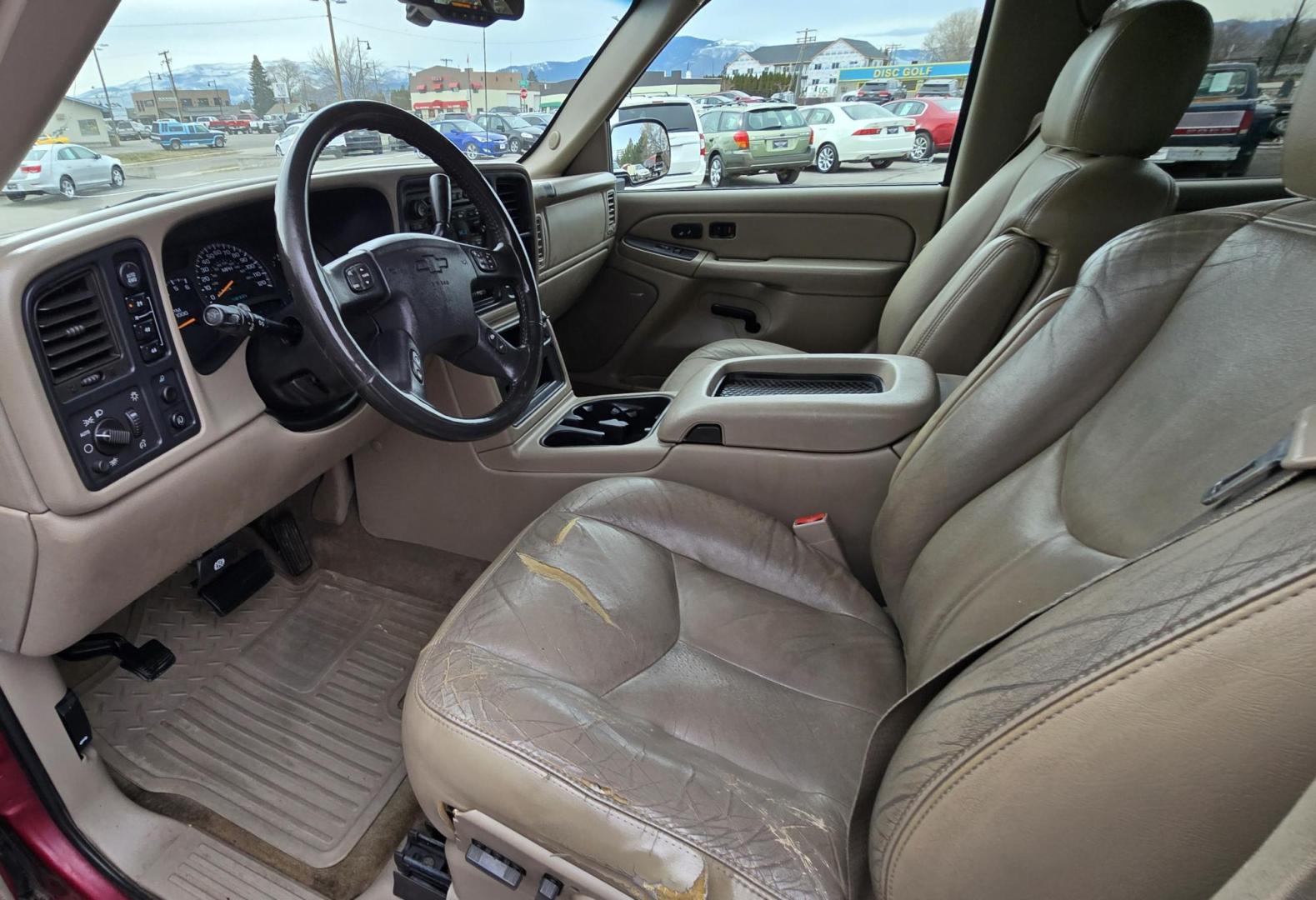 2004 Maroon /Tan Chevrolet Silverado 1500 LS Crew Cab 4WD (2GCEK13T741) with an 5.3L V8 OHV 16V engine, 4-Speed Automatic Overdrive transmission, located at 450 N Russell, Missoula, MT, 59801, (406) 543-6600, 46.874496, -114.017433 - Strong Running 4WD Chevy. 5.3L V8 Engine. Automatic Transmission. Heated Leather Power Front Seats. Rear DVD Player. Power Windows and Locks. AM FM CD Player.Running Boards. Has a check engine light saying there is a misfire but the truck runs great. Does have a Branded Title because the State of Mo - Photo#11