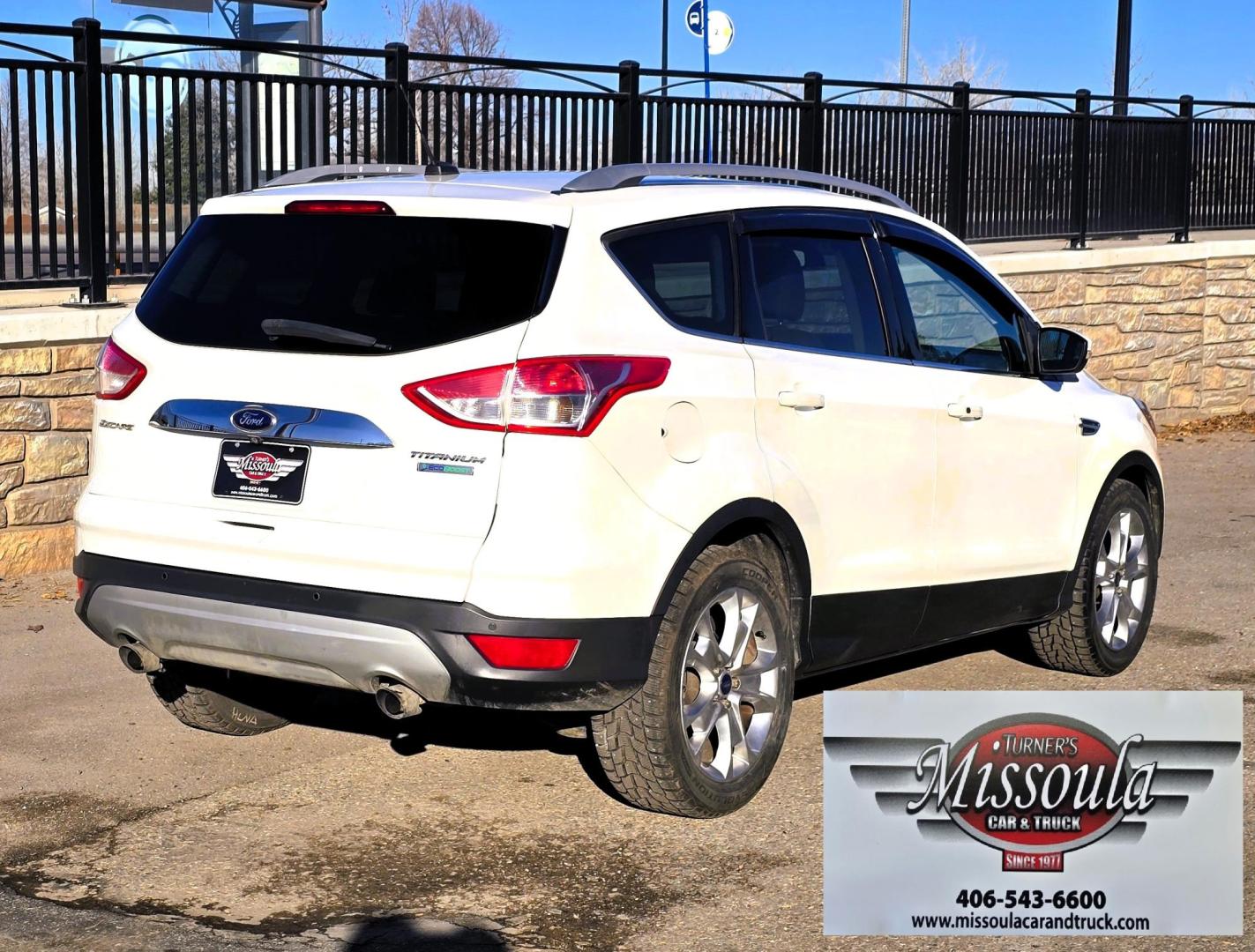 2014 White /Tan Ford Escape Titanium FWD (1FMCU0J95EU) with an 2.0L L4 DOHC 16V engine, 6-Speed Automatic transmission, located at 450 N Russell, Missoula, MT, 59801, (406) 543-6600, 46.874496, -114.017433 - Straight little SUV with a 2.0L I4 Eco Boost Engine. 6 Speed Select Shift Automatic Transmission. Navigation. Heated Leather Seats. Power Drivers Seat. Backup Camera. Blind Spot Detection System. Power Windows and Locks. Power Rear Lift Gate. Sync Voice Activated System. Bluetooth Audio and Phone. A - Photo#2