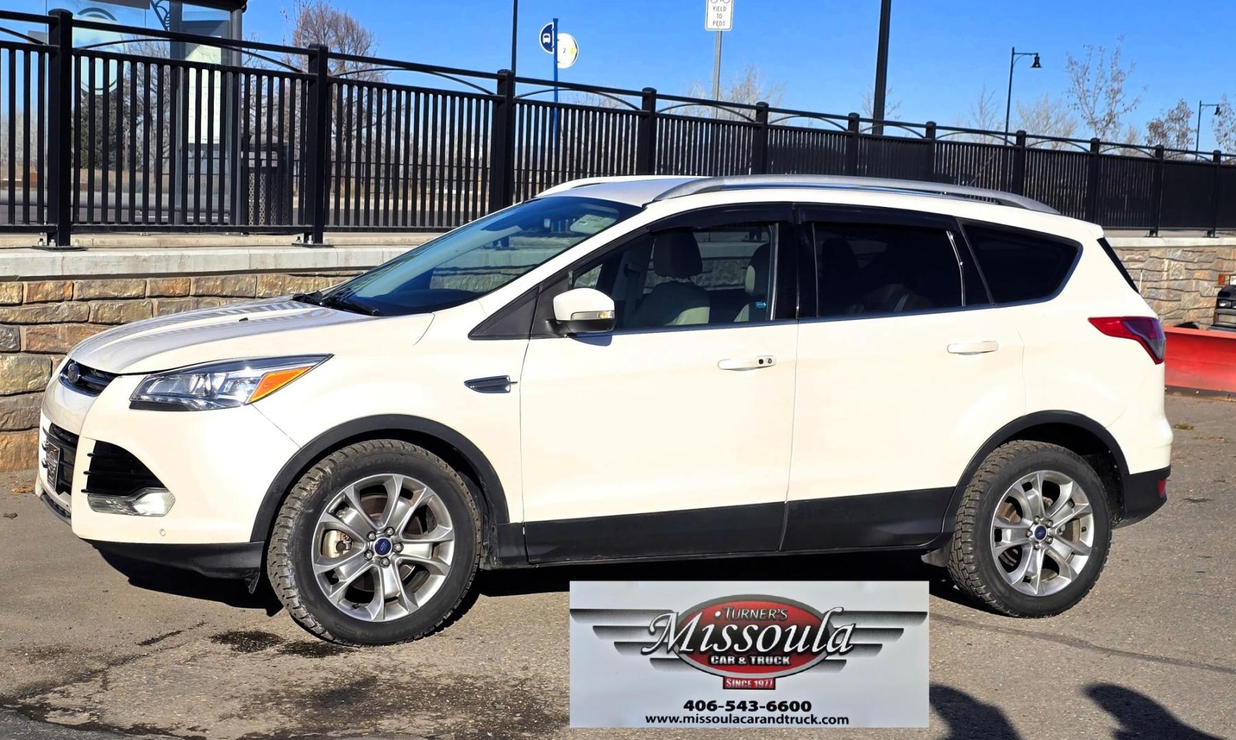 2014 White /Tan Ford Escape Titanium FWD (1FMCU0J95EU) with an 2.0L L4 DOHC 16V engine, 6-Speed Automatic transmission, located at 450 N Russell, Missoula, MT, 59801, (406) 543-6600, 46.874496, -114.017433 - Straight little SUV with a 2.0L I4 Eco Boost Engine. 6 Speed Select Shift Automatic Transmission. Navigation. Heated Leather Seats. Power Drivers Seat. Backup Camera. Blind Spot Detection System. Power Windows and Locks. Power Rear Lift Gate. Sync Voice Activated System. Bluetooth Audio and Phone. A - Photo#4