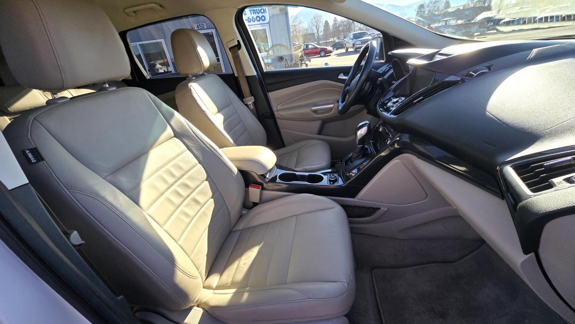 2014 White /Tan Ford Escape Titanium FWD (1FMCU0J95EU) with an 2.0L L4 DOHC 16V engine, 6-Speed Automatic transmission, located at 450 N Russell, Missoula, MT, 59801, (406) 543-6600, 46.874496, -114.017433 - Straight little SUV with a 2.0L I4 Eco Boost Engine. 6 Speed Select Shift Automatic Transmission. Navigation. Heated Leather Seats. Power Drivers Seat. Backup Camera. Blind Spot Detection System. Power Windows and Locks. Power Rear Lift Gate. Sync Voice Activated System. Bluetooth Audio and Phone. A - Photo#10