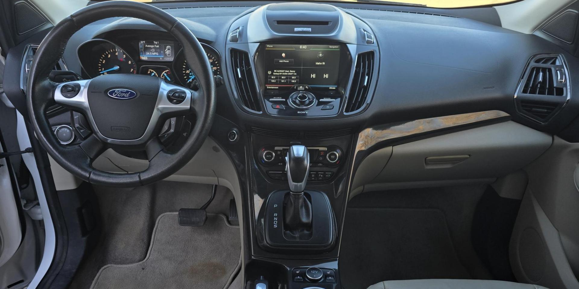 2014 White /Tan Ford Escape Titanium FWD (1FMCU0J95EU) with an 2.0L L4 DOHC 16V engine, 6-Speed Automatic transmission, located at 450 N Russell, Missoula, MT, 59801, (406) 543-6600, 46.874496, -114.017433 - Straight little SUV with a 2.0L I4 Eco Boost Engine. 6 Speed Select Shift Automatic Transmission. Navigation. Heated Leather Seats. Power Drivers Seat. Backup Camera. Blind Spot Detection System. Power Windows and Locks. Power Rear Lift Gate. Sync Voice Activated System. Bluetooth Audio and Phone. A - Photo#15