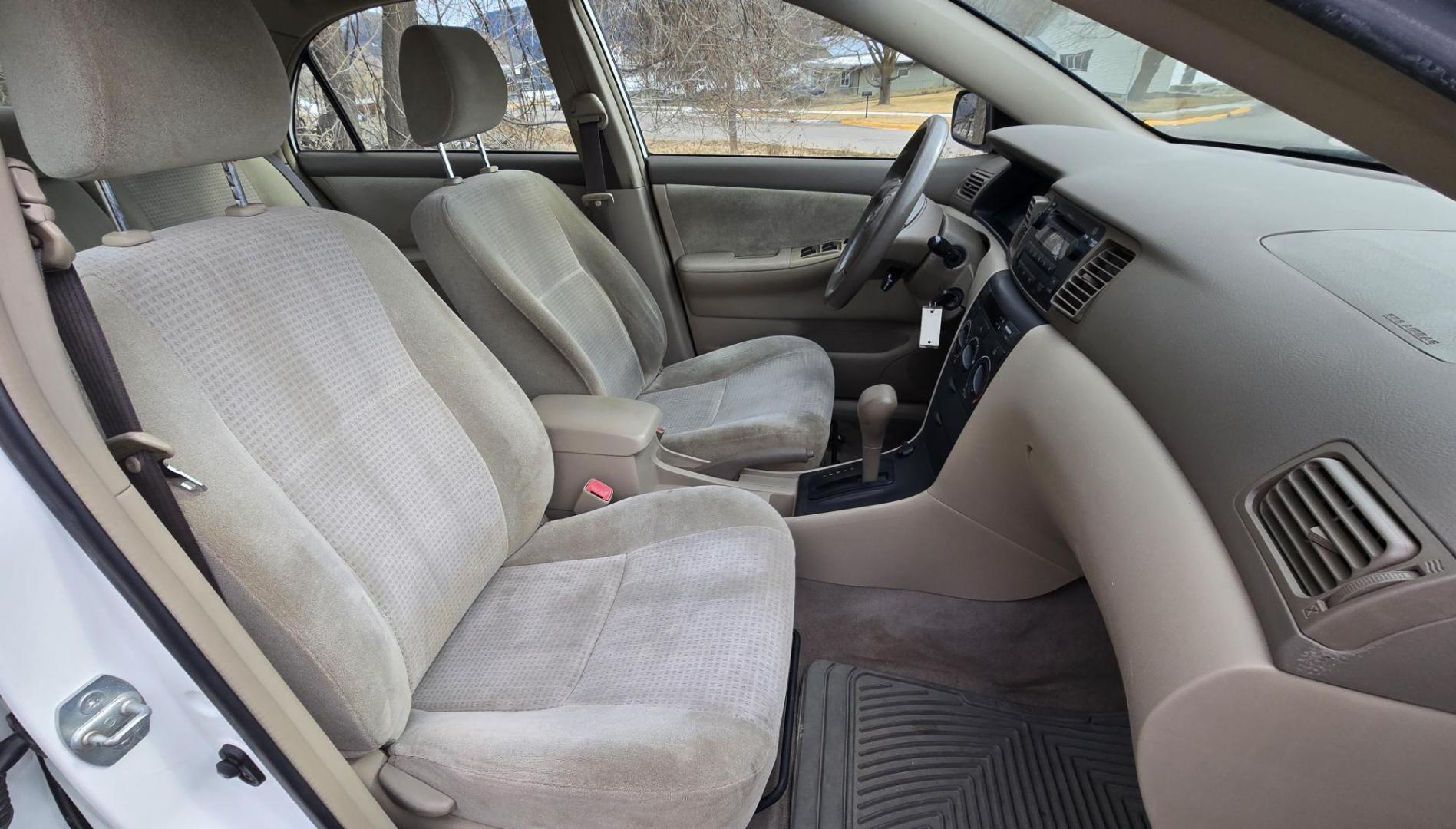 2007 White /Gray Toyota Corolla CE (JTDBR32E170) with an 1.8L L4 DOHC 16V engine, Automatic transmission, located at 450 N Russell, Missoula, MT, 59801, (406) 543-6600, 46.874496, -114.017433 - Looking for Fuel Economy at a reasonable price? Look no further. 2007 Toyota Corolla with a 1.8L I4 Engine. Automatic Transmission. Front Wheel Drive. Power Windows and Locks. Seats are in excellent condition and very comfortable. Air. Cruise. Tilt. New Brakes all around. Does have a Branded Title b - Photo#9