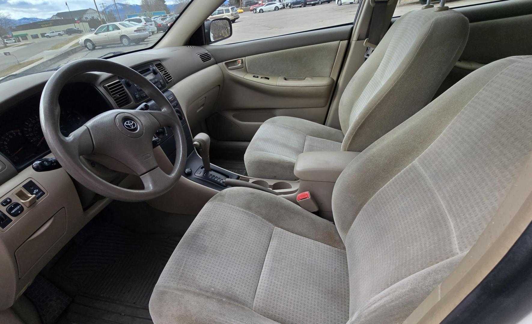 2007 White /Gray Toyota Corolla CE (JTDBR32E170) with an 1.8L L4 DOHC 16V engine, Automatic transmission, located at 450 N Russell, Missoula, MT, 59801, (406) 543-6600, 46.874496, -114.017433 - Looking for Fuel Economy at a reasonable price? Look no further. 2007 Toyota Corolla with a 1.8L I4 Engine. Automatic Transmission. Front Wheel Drive. Power Windows and Locks. Seats are in excellent condition and very comfortable. Air. Cruise. Tilt. New Brakes all around. Does have a Branded Title b - Photo#11