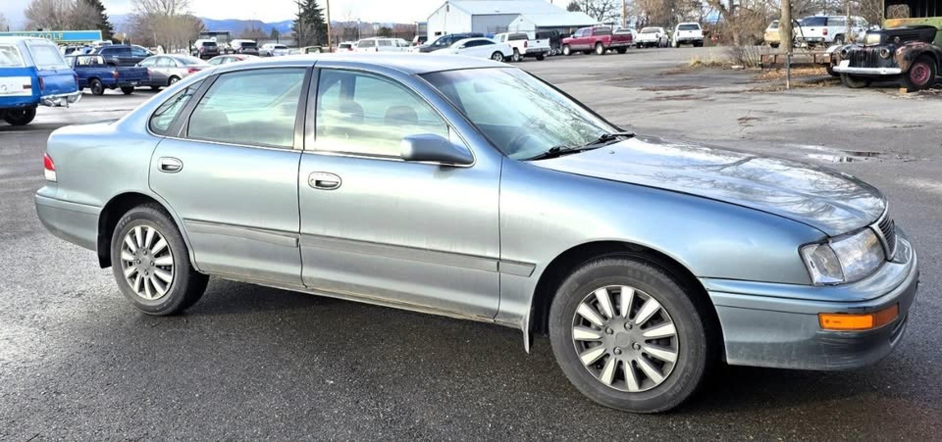 1997 Green /Tan Toyota Avalon XL (4T1BF12BXVU) with an 3.0L V6 SOHC 24V engine, 4-Speed Automatic Overdrive transmission, located at 450 N Russell, Missoula, MT, 59801, (406) 543-6600, 46.874496, -114.017433 - 1997 Toyota Avalon XL. 3.0L V6 Engine Runs Great. Automatic Transmission. Air Cruise. Tilt. Power Windows and Locks. Lots of miles but you wouldn't know it but the condition and how well it drives. Two Owner with no accidents. Clean Title and Carfax. Has a P0773 Check Engine Light. "Shift Solenoid" - Photo#2