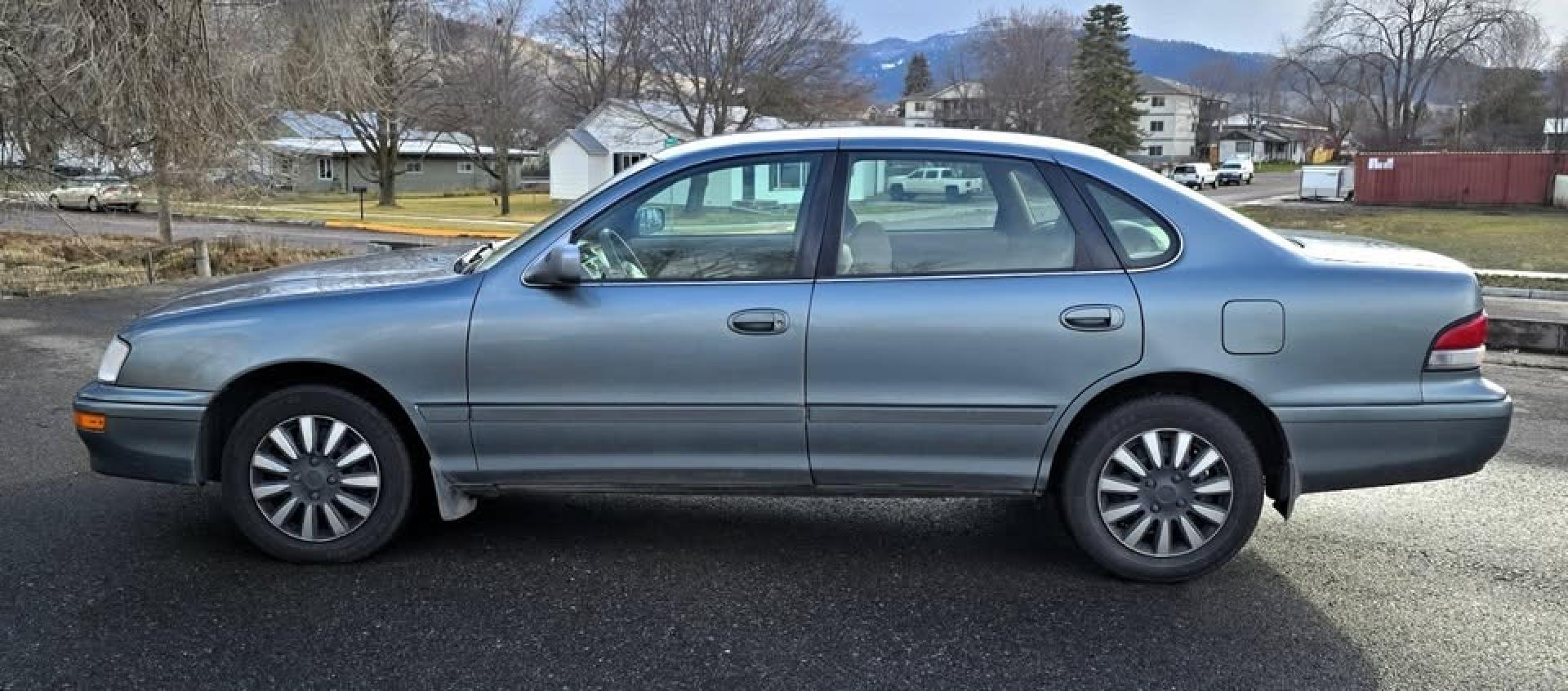 1997 Green /Tan Toyota Avalon XL (4T1BF12BXVU) with an 3.0L V6 SOHC 24V engine, 4-Speed Automatic Overdrive transmission, located at 450 N Russell, Missoula, MT, 59801, (406) 543-6600, 46.874496, -114.017433 - 1997 Toyota Avalon XL. 3.0L V6 Engine Runs Great. Automatic Transmission. Air Cruise. Tilt. Power Windows and Locks. Lots of miles but you wouldn't know it but the condition and how well it drives. Two Owner with no accidents. Clean Title and Carfax. Has a P0773 Check Engine Light. "Shift Solenoid" - Photo#1