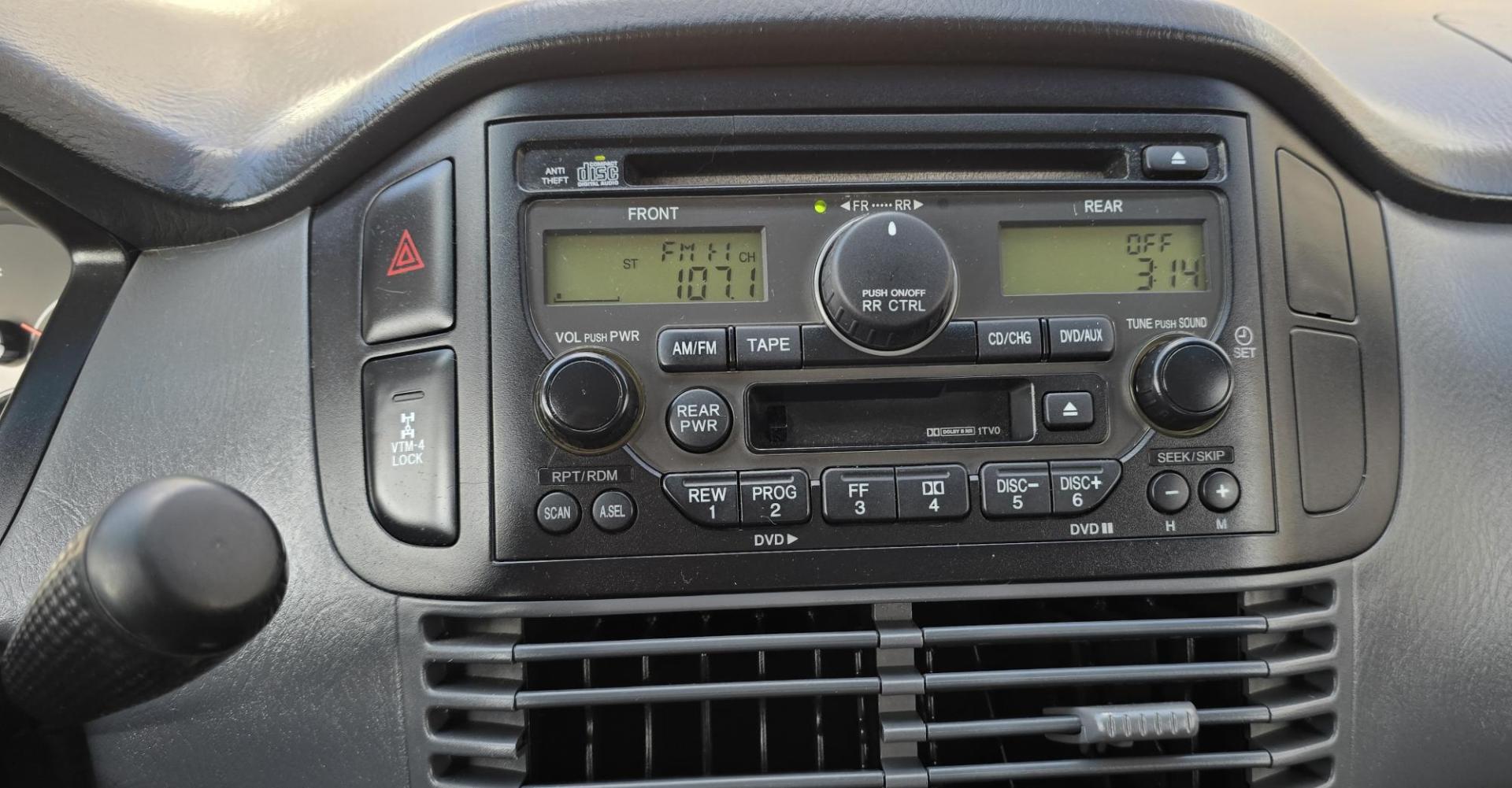 2004 Blue /Black Honda Pilot EX w/ Leather and DVD (2HKYF18664H) with an 3.5L V6 SOHC 24V engine, 5-Speed Automatic Overdrive transmission, located at 450 N Russell, Missoula, MT, 59801, (406) 543-6600, 46.874496, -114.017433 - Great Running AWD Honda. 3.5L V6 Engine. 3rd Row Seating. Heated Front Seats. Power Drivers Seat. Rear Entertainment. Air. Cruise. Tilt. Power Windows and Locks. Remote Start. Has some rust and the front seats are worn. Has an Air Bag Light so we are selling AS-IS. Clean Title and Carfax. No Fina - Photo#18