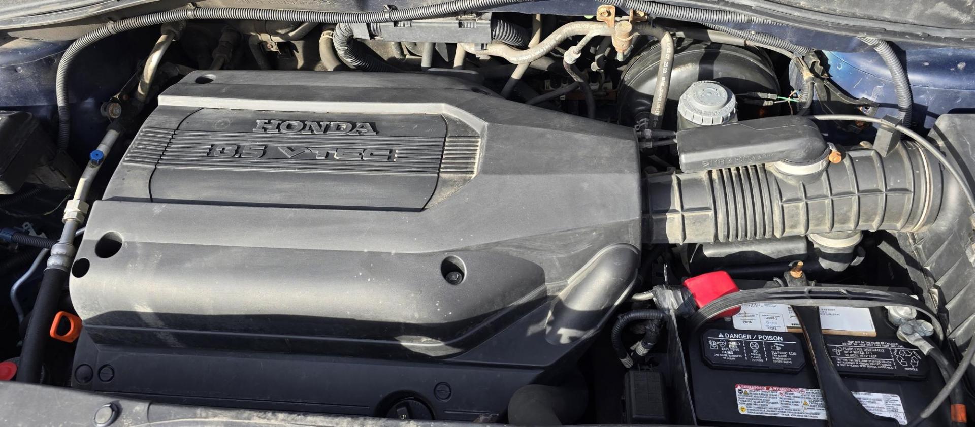 2004 Blue /Black Honda Pilot EX w/ Leather and DVD (2HKYF18664H) with an 3.5L V6 SOHC 24V engine, 5-Speed Automatic Overdrive transmission, located at 450 N Russell, Missoula, MT, 59801, (406) 543-6600, 46.874496, -114.017433 - Great Running AWD Honda. 3.5L V6 Engine. 3rd Row Seating. Heated Front Seats. Power Drivers Seat. Rear Entertainment. Air. Cruise. Tilt. Power Windows and Locks. Remote Start. Has some rust and the front seats are worn. Has an Air Bag Light so we are selling AS-IS. Clean Title and Carfax. No Fina - Photo#21