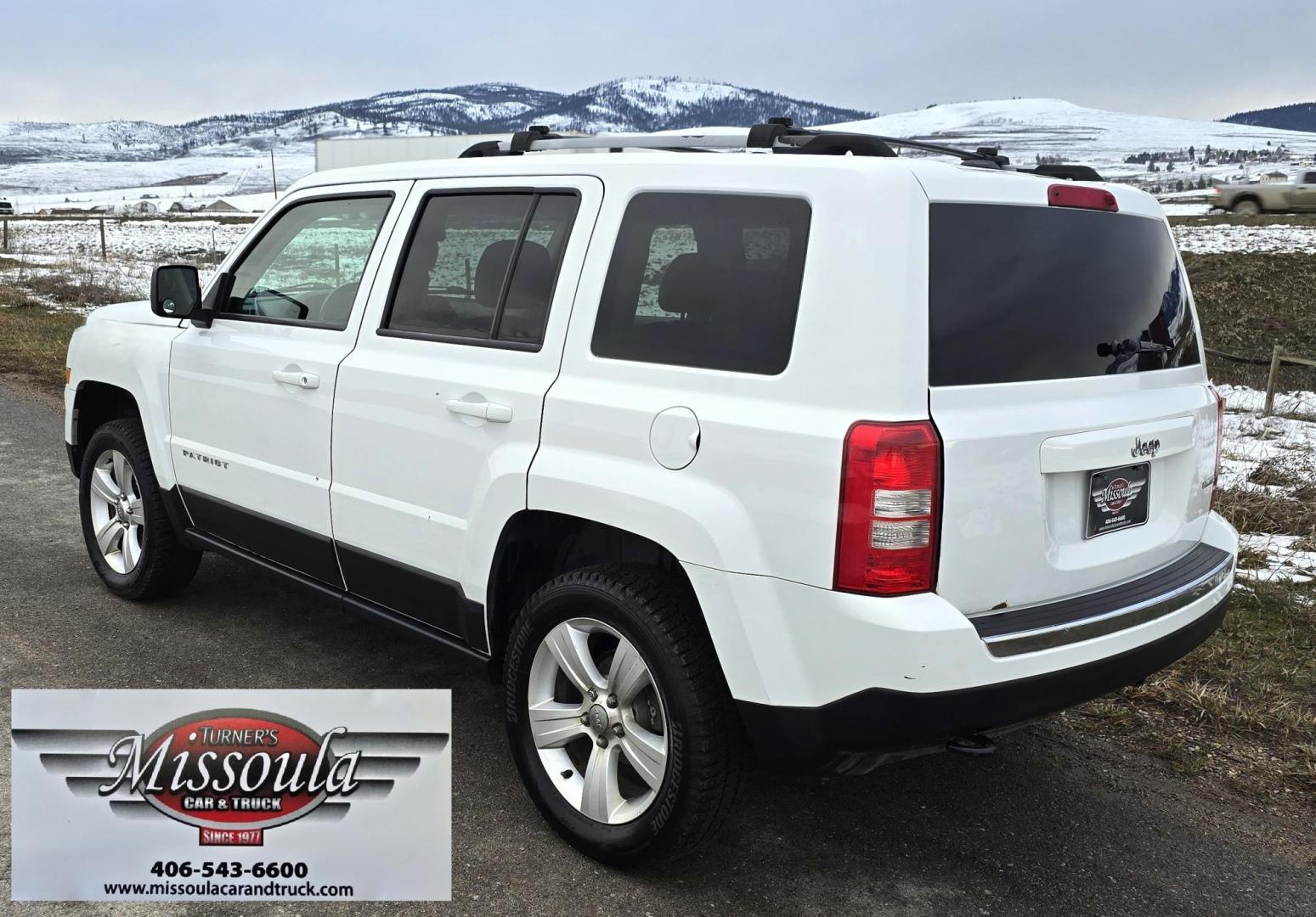2014 White /Tan Jeep Patriot Limited 4WD (1C4NJRCB0ED) with an 2.4L L4 DOHC 16V engine, Automatic transmission, located at 450 N Russell, Missoula, MT, 59801, (406) 543-6600, 46.874496, -114.017433 - Cute 4WD Jeep Patriot. 2.4L I4 Engine has good Pep but also gets solid fuel economy. Automatic Transmission. Air. Cruise. Tilt. Power Windows and Locks. Bluetooth. AM FM CD Player. Power Drivers Seat. Heated Front Seats. Bridgestone Tires. Runs and Drives Excellent. Cl - Photo#1