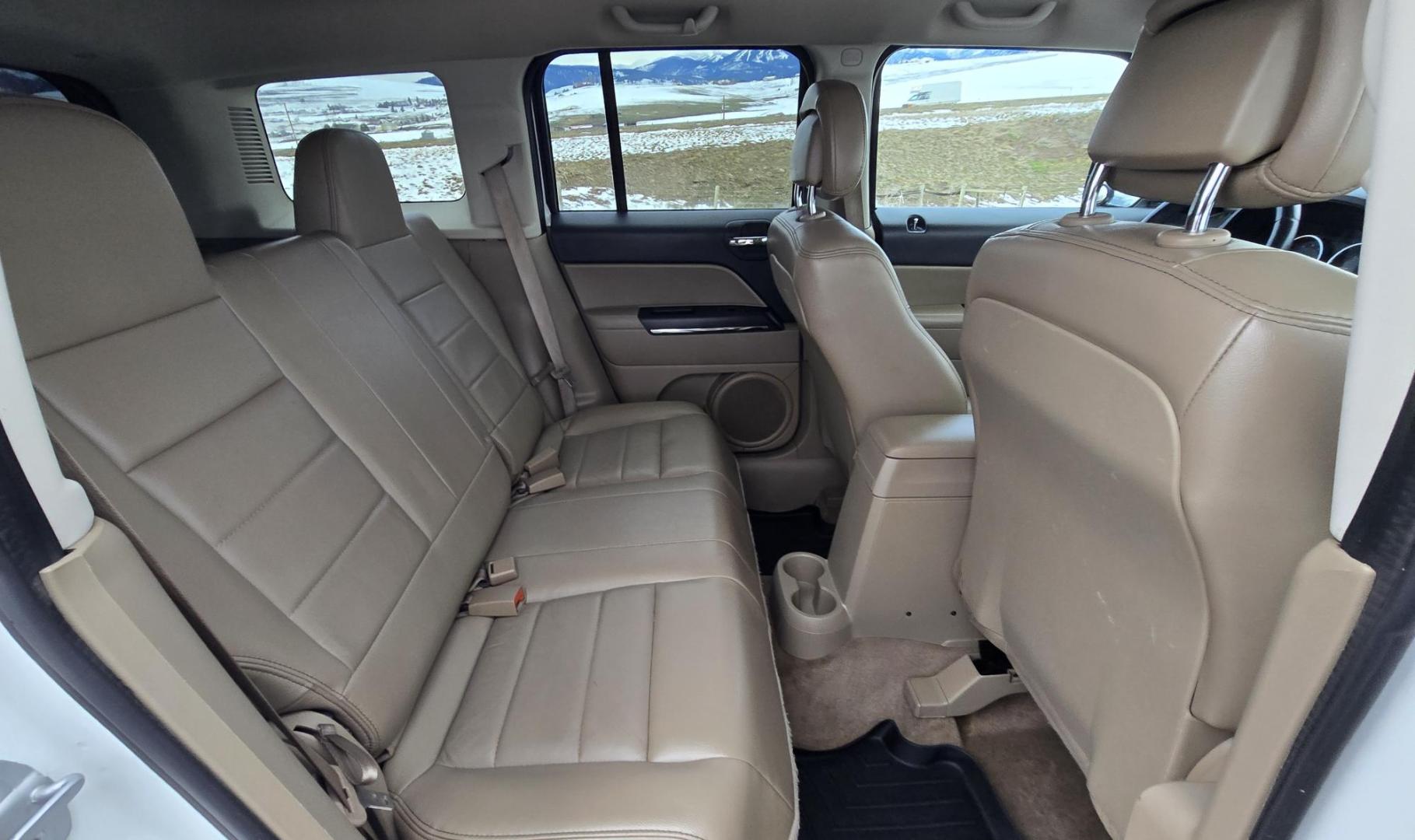 2014 White /Tan Jeep Patriot Limited 4WD (1C4NJRCB0ED) with an 2.4L L4 DOHC 16V engine, Automatic transmission, located at 450 N Russell, Missoula, MT, 59801, (406) 543-6600, 46.874496, -114.017433 - Cute 4WD Jeep Patriot. 2.4L I4 Engine has good Pep but also gets solid fuel economy. Automatic Transmission. Air. Cruise. Tilt. Power Windows and Locks. Bluetooth. AM FM CD Player. Power Drivers Seat. Heated Front Seats. Bridgestone Tires. Runs and Drives Excellent. Cl - Photo#8