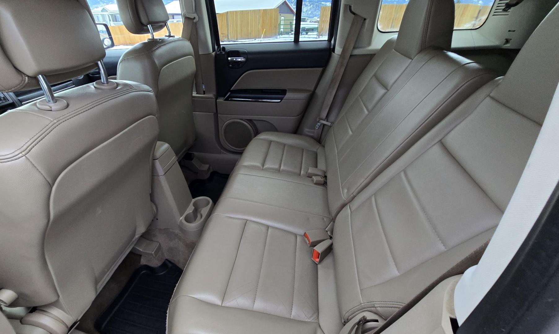 2014 White /Tan Jeep Patriot Limited 4WD (1C4NJRCB0ED) with an 2.4L L4 DOHC 16V engine, Automatic transmission, located at 450 N Russell, Missoula, MT, 59801, (406) 543-6600, 46.874496, -114.017433 - Cute 4WD Jeep Patriot. 2.4L I4 Engine has good Pep but also gets solid fuel economy. Automatic Transmission. Air. Cruise. Tilt. Power Windows and Locks. Bluetooth. AM FM CD Player. Power Drivers Seat. Heated Front Seats. Bridgestone Tires. Runs and Drives Excellent. Cl - Photo#10