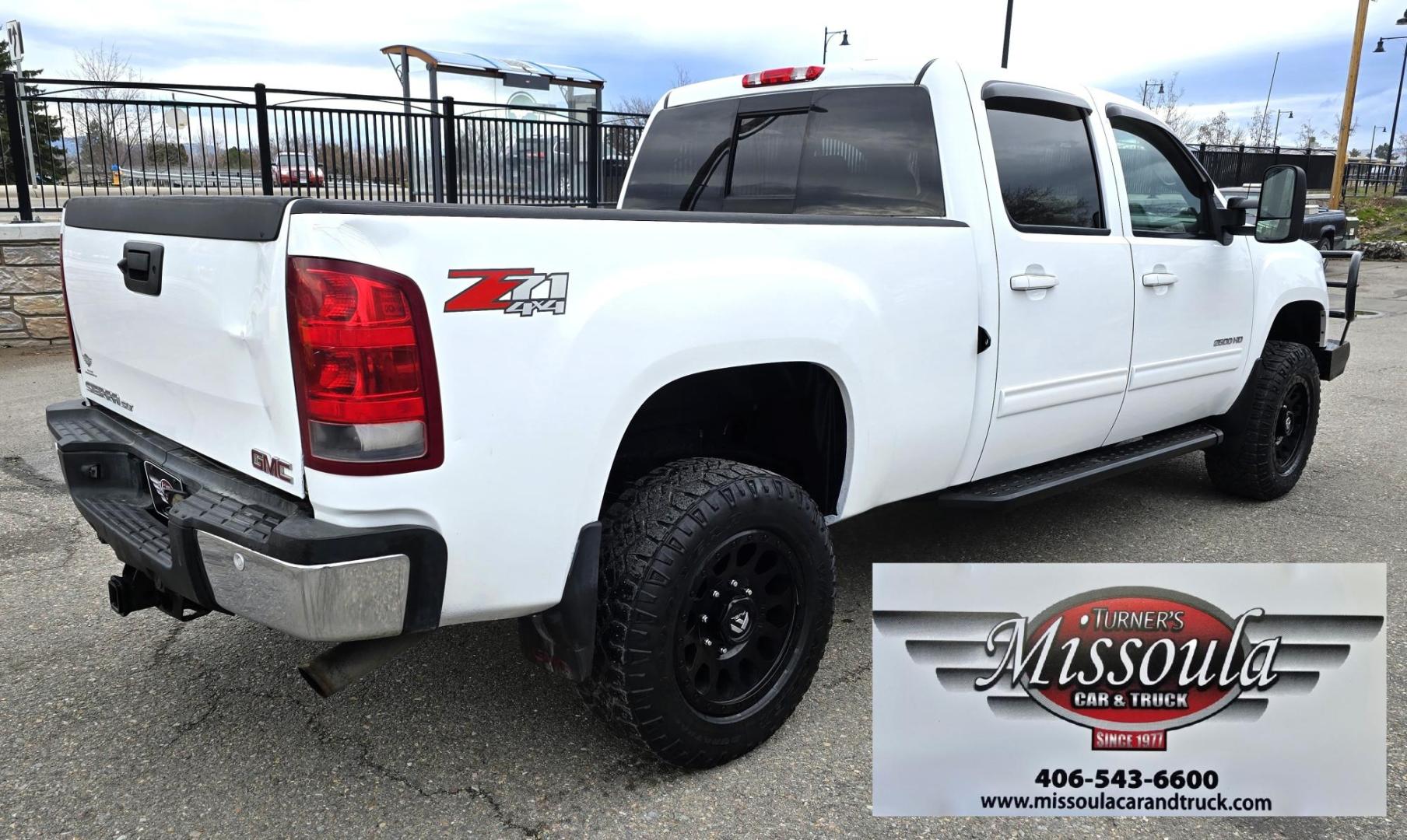 2013 White /Tan GMC Sierra 2500HD SLT Crew Cab 4WD (1GT121EG3DF) with an 6.0L V8 OHV 16V FFV engine, 6-Speed Automatic transmission, located at 450 N Russell, Missoula, MT, 59801, (406) 543-6600, 46.874496, -114.017433 - Very Clean 3/4 Ton 4WD Crewcab. Beefy 6.0L V8 Engine. 6 Speed Automatic Transmission. Power Heated Front Seats. Leather Seats. Navigation. Bluetooth Audio and Phone. AM FM CD Player. Backup Camera. Air. cruise. Tilt. Power Windows and Locks. Remote Start. Nice Custom Wheels. Grill Guard. Running Boa - Photo#2