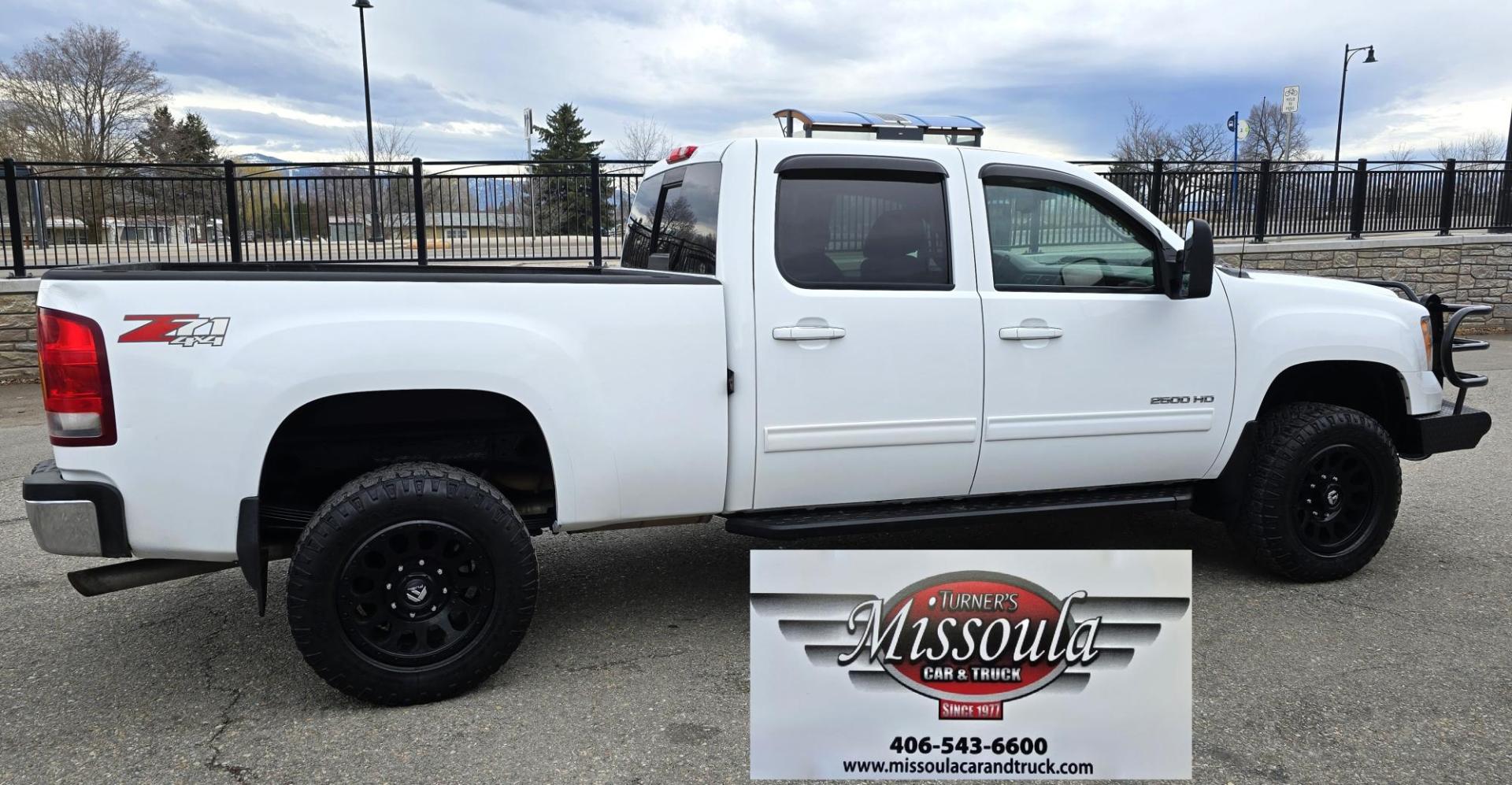 2013 White /Tan GMC Sierra 2500HD SLT Crew Cab 4WD (1GT121EG3DF) with an 6.0L V8 OHV 16V FFV engine, 6-Speed Automatic transmission, located at 450 N Russell, Missoula, MT, 59801, (406) 543-6600, 46.874496, -114.017433 - Very Clean 3/4 Ton 4WD Crewcab. Beefy 6.0L V8 Engine. 6 Speed Automatic Transmission. Power Heated Front Seats. Leather Seats. Navigation. Bluetooth Audio and Phone. AM FM CD Player. Backup Camera. Air. cruise. Tilt. Power Windows and Locks. Remote Start. Nice Custom Wheels. Grill Guard. Running Boa - Photo#1