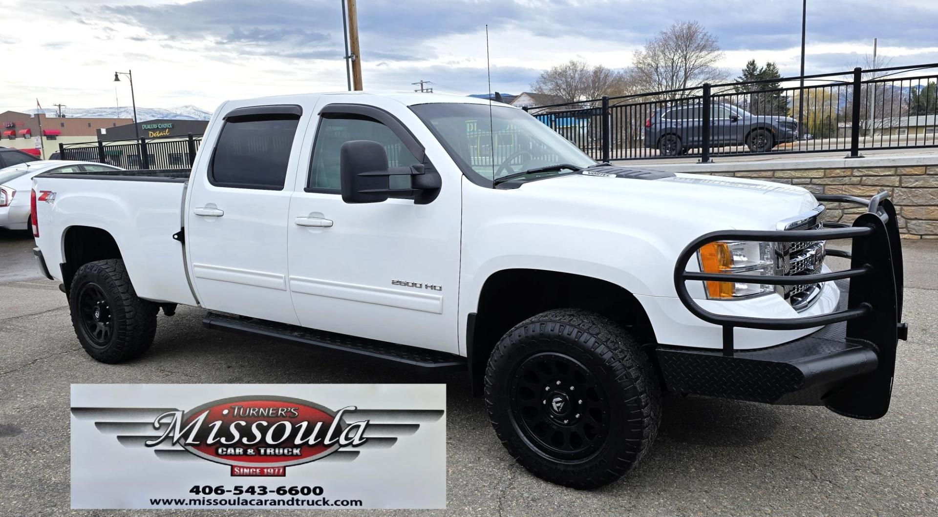 2013 White /Tan GMC Sierra 2500HD SLT Crew Cab 4WD (1GT121EG3DF) with an 6.0L V8 OHV 16V FFV engine, 6-Speed Automatic transmission, located at 450 N Russell, Missoula, MT, 59801, (406) 543-6600, 46.874496, -114.017433 - Very Clean 3/4 Ton 4WD Crewcab. Beefy 6.0L V8 Engine. 6 Speed Automatic Transmission. Power Heated Front Seats. Leather Seats. Navigation. Bluetooth Audio and Phone. AM FM CD Player. Backup Camera. Air. cruise. Tilt. Power Windows and Locks. Remote Start. Nice Custom Wheels. Grill Guard. Running Boa - Photo#3