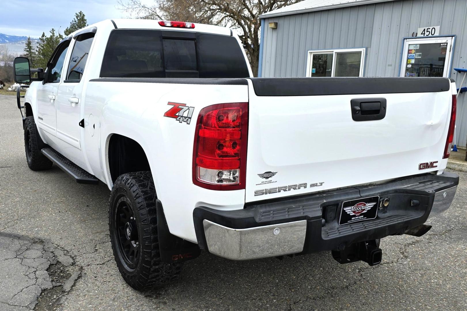 2013 White /Tan GMC Sierra 2500HD SLT Crew Cab 4WD (1GT121EG3DF) with an 6.0L V8 OHV 16V FFV engine, 6-Speed Automatic transmission, located at 450 N Russell, Missoula, MT, 59801, (406) 543-6600, 46.874496, -114.017433 - Very Clean 3/4 Ton 4WD Crewcab. Beefy 6.0L V8 Engine. 6 Speed Automatic Transmission. Power Heated Front Seats. Leather Seats. Navigation. Bluetooth Audio and Phone. AM FM CD Player. Backup Camera. Air. cruise. Tilt. Power Windows and Locks. Remote Start. Nice Custom Wheels. Grill Guard. Running Boa - Photo#8