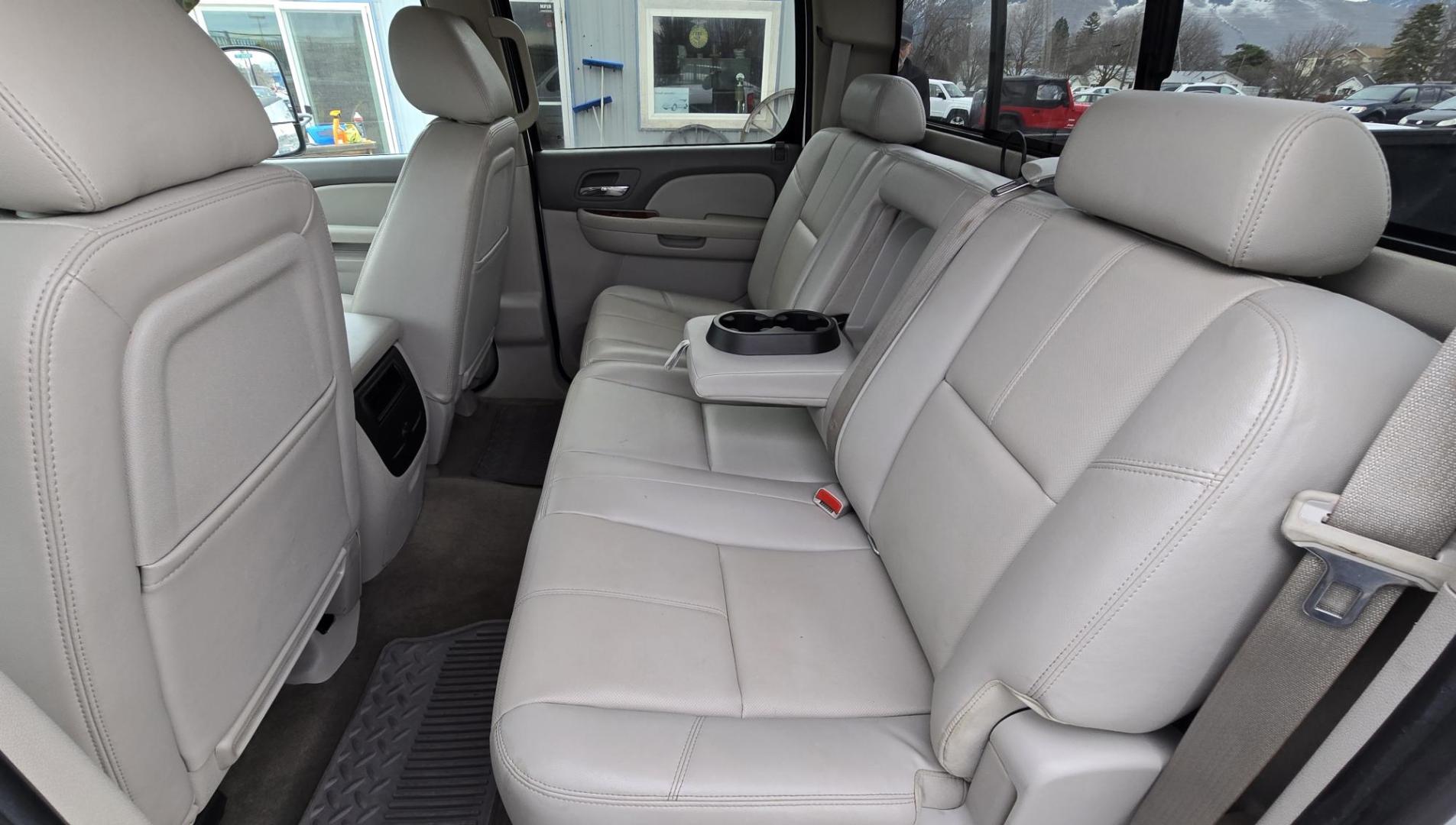 2013 White /Tan GMC Sierra 2500HD SLT Crew Cab 4WD (1GT121EG3DF) with an 6.0L V8 OHV 16V FFV engine, 6-Speed Automatic transmission, located at 450 N Russell, Missoula, MT, 59801, (406) 543-6600, 46.874496, -114.017433 - Very Clean 3/4 Ton 4WD Crewcab. Beefy 6.0L V8 Engine. 6 Speed Automatic Transmission. Power Heated Front Seats. Leather Seats. Navigation. Bluetooth Audio and Phone. AM FM CD Player. Backup Camera. Air. cruise. Tilt. Power Windows and Locks. Remote Start. Nice Custom Wheels. Grill Guard. Running Boa - Photo#11