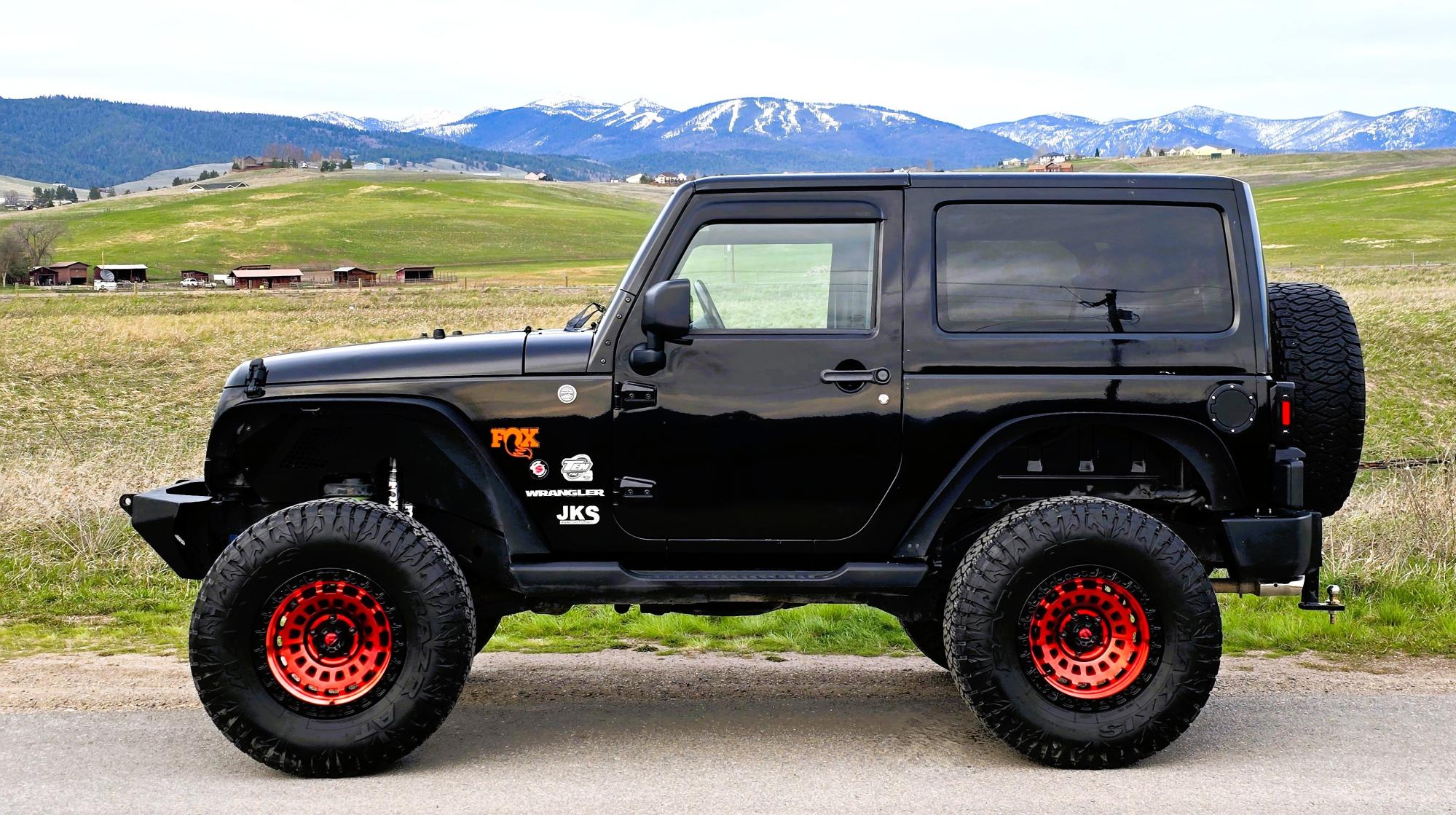 photo of 2011 Jeep Wrangler Sport 4WD 6 Speed Manual!