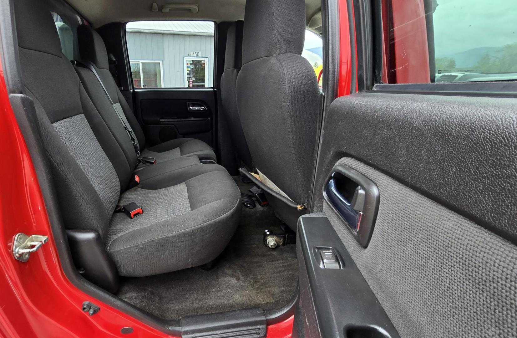 2011 Red /Tan Chevrolet Colorado 1LT Crew Cab 4WD (1GCHTCFE2B8) with an 2.9L L4 DOHC 16V engine, Automatic transmission, located at 450 N Russell, Missoula, MT, 59801, (406) 543-6600, 46.874496, -114.017433 - Yes it has a lot of Miles but come drive it and you will be impressed. 3.7L I5 Engine. Automatic Transmission. Air. Cruise. Tilt. Power Windows and Locks. Matching Topper. Because if the miles. Financing is NOT Available on this vehicle. - Photo#12