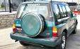 1997 Green Suzuki Sidekick JX 4-Door 4WD (2S3TD03V7V6) with an 1.6L L4 SOHC 16V engine, 5 Speed Manual transmission, located at 450 N Russell, Missoula, MT, 59801, (406) 543-6600, 46.874496, -114.017433 - Photo#3