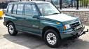 1997 Green Suzuki Sidekick JX 4-Door 4WD (2S3TD03V7V6) with an 1.6L L4 SOHC 16V engine, 5 Speed Manual transmission, located at 450 N Russell, Missoula, MT, 59801, (406) 543-6600, 46.874496, -114.017433 - Photo#4