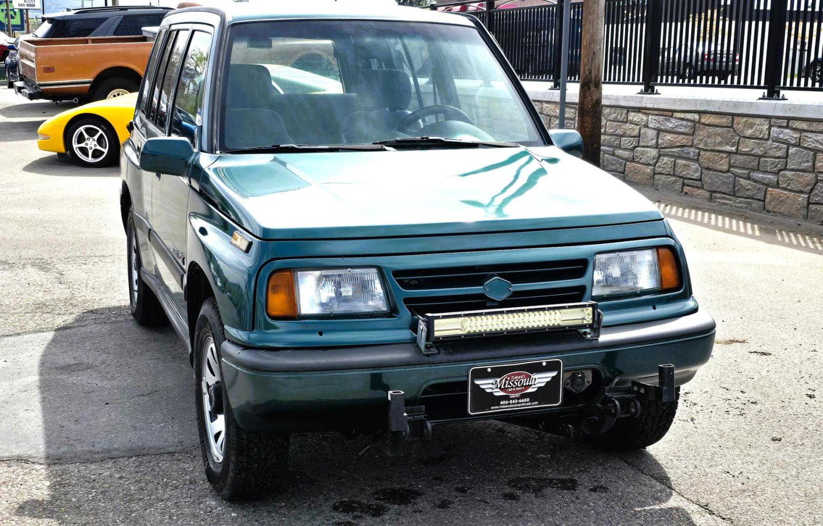 1997 Green Suzuki Sidekick JX 4-Door 4WD (2S3TD03V7V6) with an 1.6L L4 SOHC 16V engine, 5 Speed Manual transmission, located at 450 N Russell, Missoula, MT, 59801, (406) 543-6600, 46.874496, -114.017433 - Photo#5