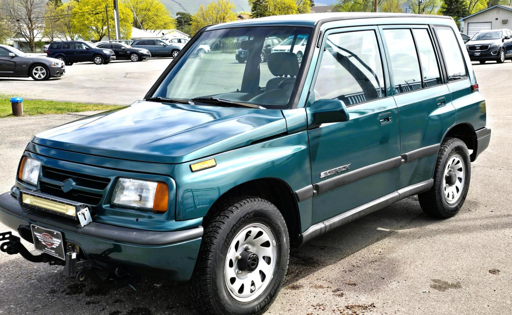 1997 Green Suzuki Sidekick JX 4-Door 4WD (2S3TD03V7V6) with an 1.6L L4 SOHC 16V engine, 5 Speed Manual transmission, located at 450 N Russell, Missoula, MT, 59801, (406) 543-6600, 46.874496, -114.017433 - Photo#6