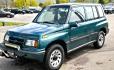 1997 Green Suzuki Sidekick JX 4-Door 4WD (2S3TD03V7V6) with an 1.6L L4 SOHC 16V engine, 5 Speed Manual transmission, located at 450 N Russell, Missoula, MT, 59801, (406) 543-6600, 46.874496, -114.017433 - Photo#6
