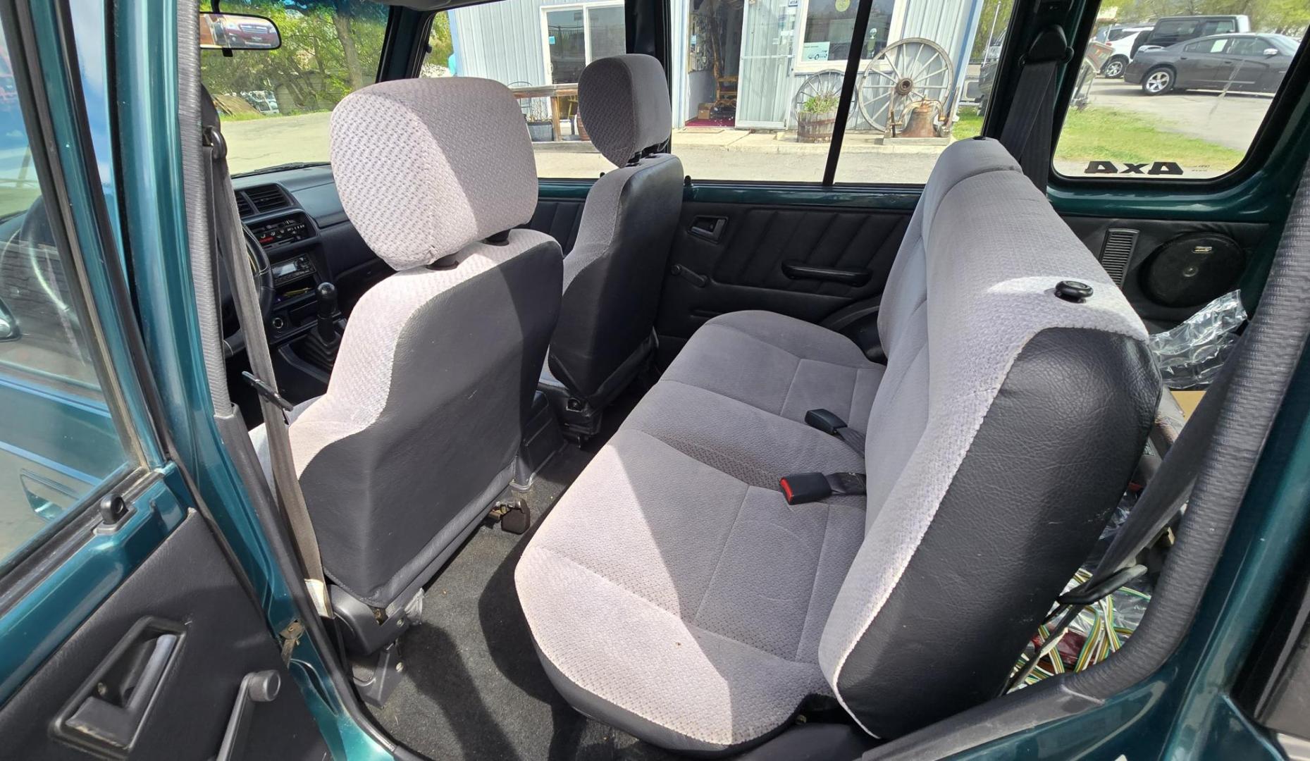 1997 Green Suzuki Sidekick JX 4-Door 4WD (2S3TD03V7V6) with an 1.6L L4 SOHC 16V engine, 5 Speed Manual transmission, located at 450 N Russell, Missoula, MT, 59801, (406) 543-6600, 46.874496, -114.017433 - Photo#9