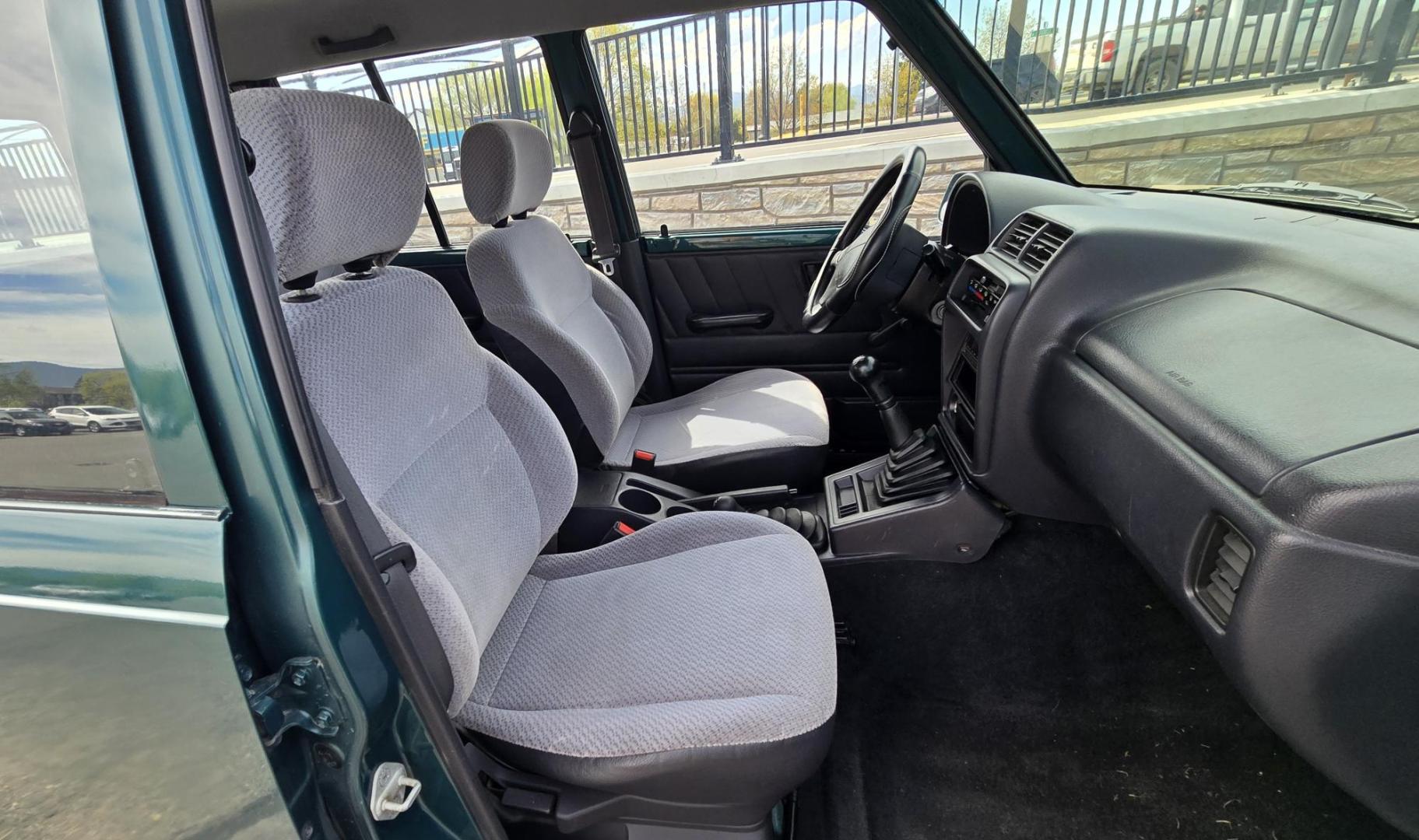 1997 Green Suzuki Sidekick JX 4-Door 4WD (2S3TD03V7V6) with an 1.6L L4 SOHC 16V engine, 5 Speed Manual transmission, located at 450 N Russell, Missoula, MT, 59801, (406) 543-6600, 46.874496, -114.017433 - Photo#10