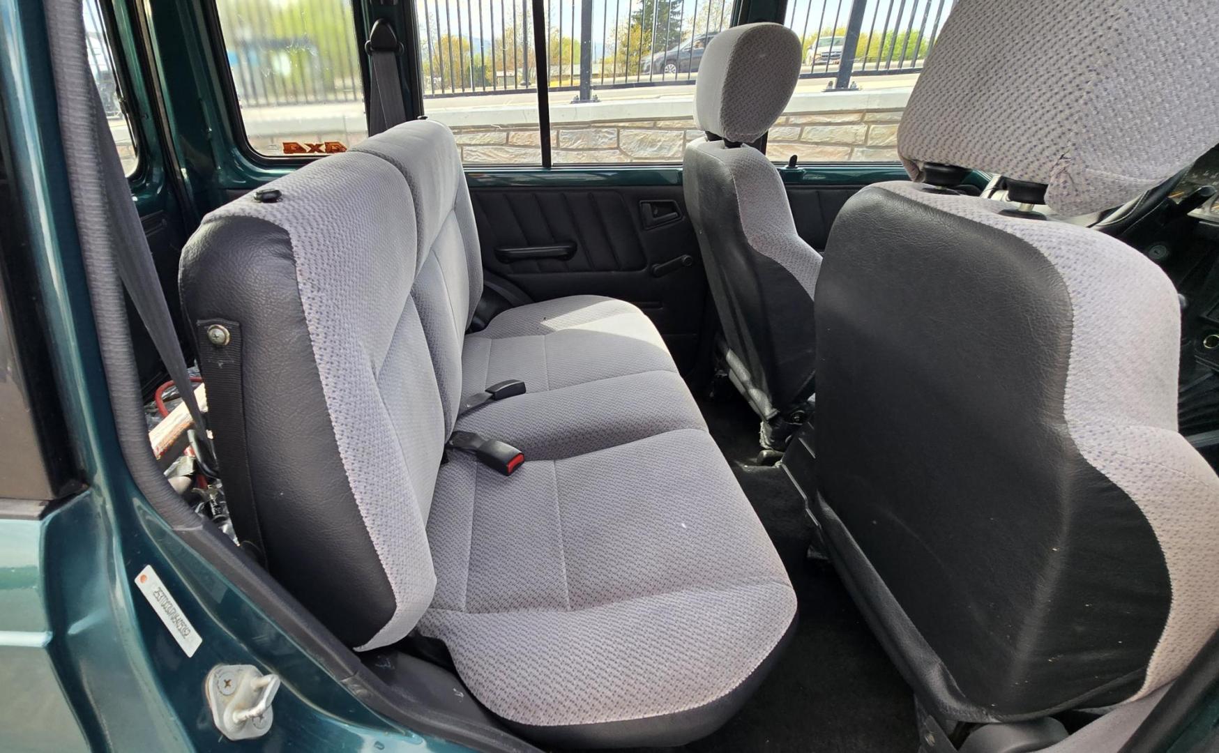1997 Green Suzuki Sidekick JX 4-Door 4WD (2S3TD03V7V6) with an 1.6L L4 SOHC 16V engine, 5 Speed Manual transmission, located at 450 N Russell, Missoula, MT, 59801, (406) 543-6600, 46.874496, -114.017433 - Photo#11