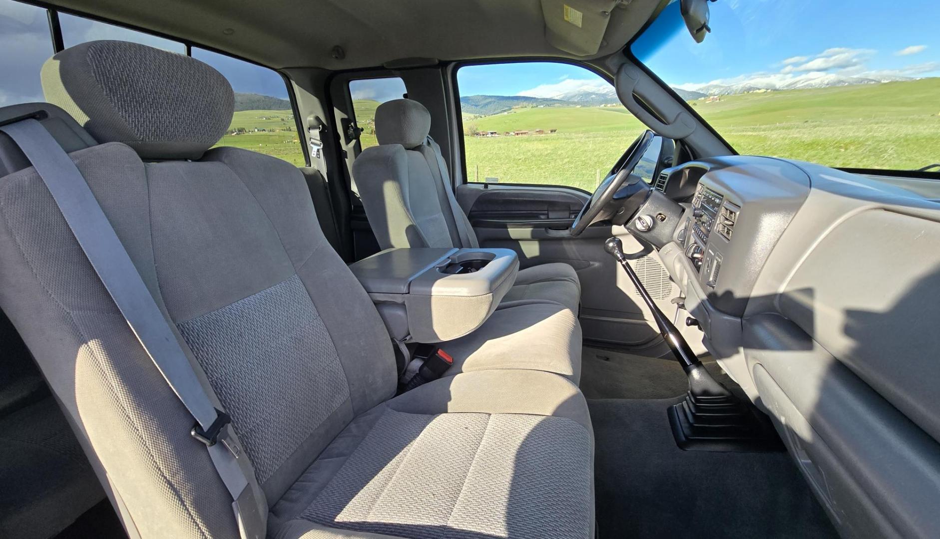 2003 Silver /Gray Ford F-250 SD XLT SuperCab 4WD (1FTNX21P43E) with an 6.0L V8 OHV 32V TURBO DIESEL engine, 6 Speed Manual transmission, located at 450 N Russell, Missoula, MT, 59801, (406) 543-6600, 46.874496, -114.017433 - Practically a Unicorn. 2 Owner Long Box 6.0 PowerStroke Diesel with a 6 Speed Manual Transmission. The Ultimate Work Truck. Power Drivers Seat. Air. Cruise. Tilt. Power Windows and Locks. Excellent Tires. AM FM CD Changer. Because of the age, our lenders do NOT offer financing on this vehicle. - Photo#13