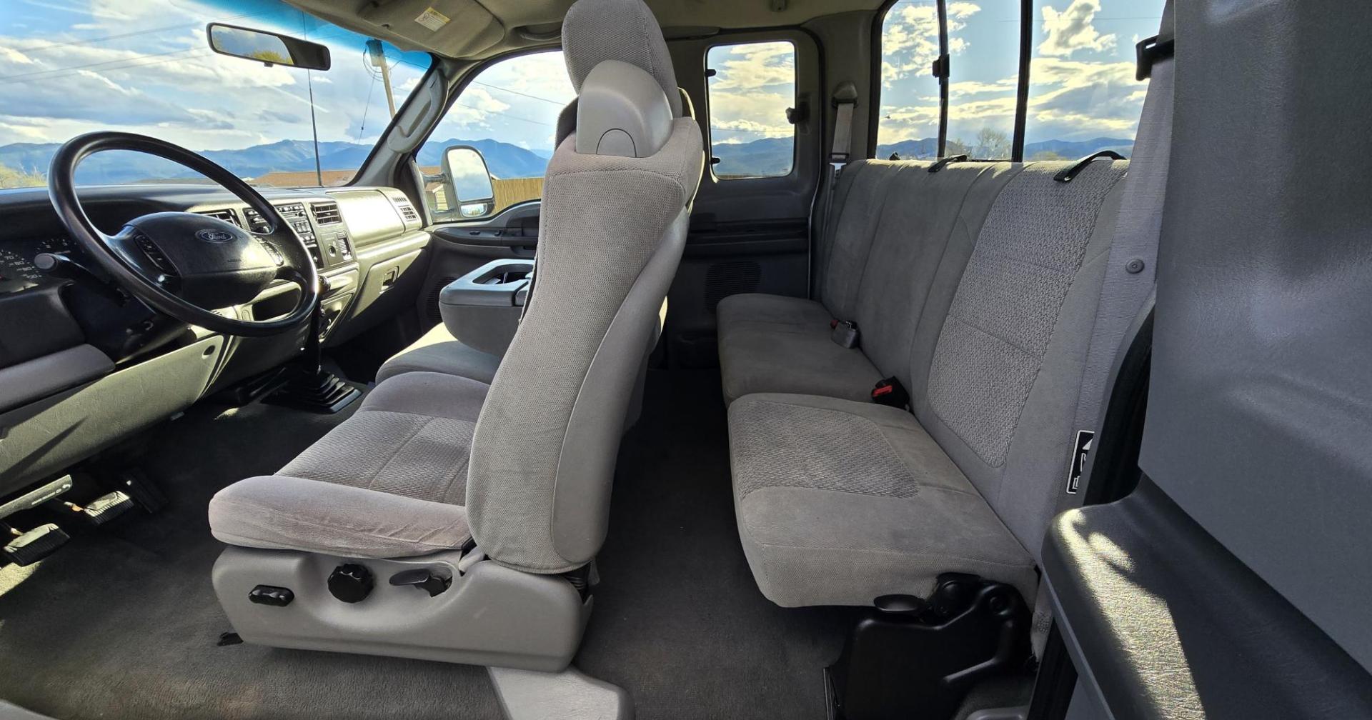 2003 Silver /Gray Ford F-250 SD XLT SuperCab 4WD (1FTNX21P43E) with an 6.0L V8 OHV 32V TURBO DIESEL engine, 6 Speed Manual transmission, located at 450 N Russell, Missoula, MT, 59801, (406) 543-6600, 46.874496, -114.017433 - Practically a Unicorn. 2 Owner Long Box 6.0 PowerStroke Diesel with a 6 Speed Manual Transmission. The Ultimate Work Truck. Power Drivers Seat. Air. Cruise. Tilt. Power Windows and Locks. Excellent Tires. AM FM CD Changer. Because of the age, our lenders do NOT offer financing on this vehicle. - Photo#12