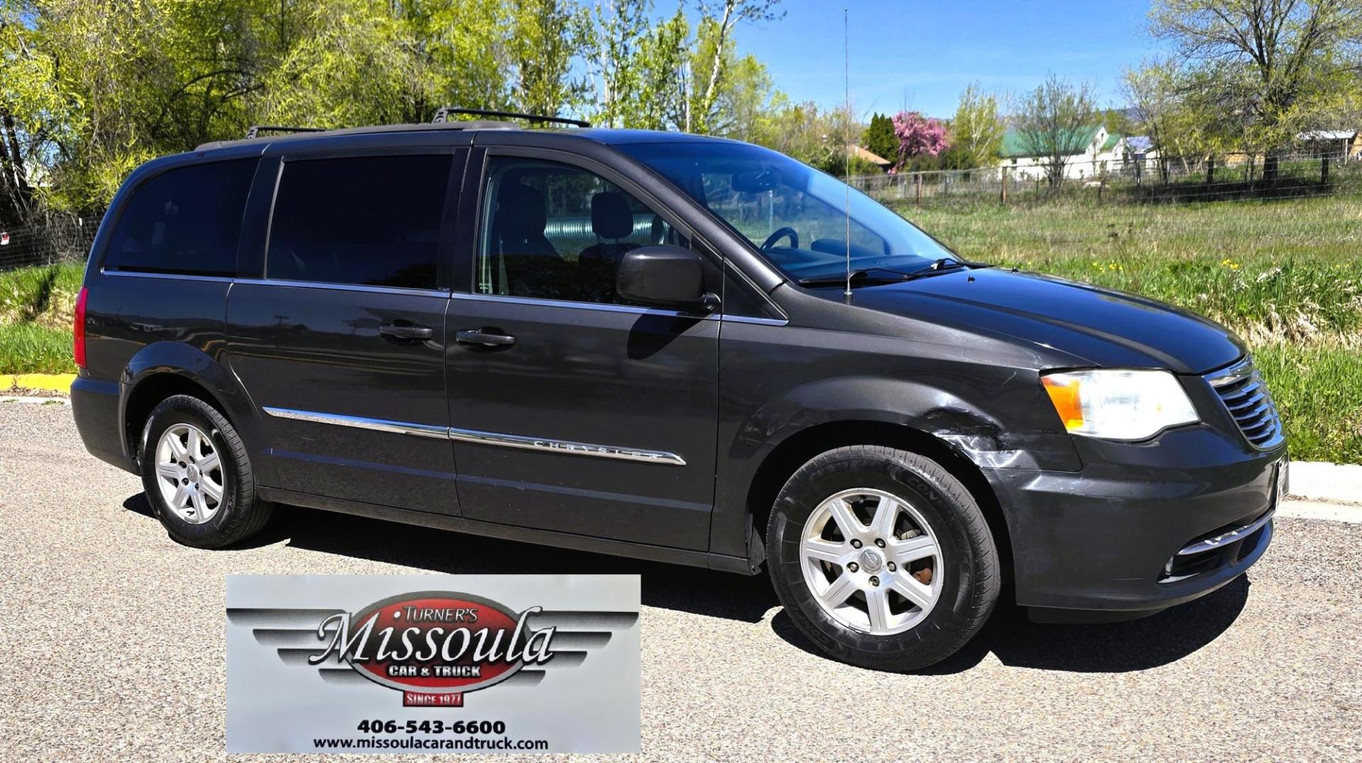 2012 Blue /Black Chrysler Town & Country Touring (2C4RC1BG5CR) with an 3.6L V6 DOHC 24V engine, 6-Speed Automatic transmission, located at 450 N Russell, Missoula, MT, 59801, (406) 543-6600, 46.874496, -114.017433 - Excellent Running Mini-Van. Zippy 3.6L V6 Engine. 6 Speed Automatic Transmission. 3rd Row Seating. Air. Cruise. Tilt. Power Windows and Locks. Rear Entertainment. Power Sliding Doors. Power Drivers Seat. AM FM SAT Touch Screen.Bluetooth Audio and Phone. Backup Camera. One small dent in the right fro - Photo#1