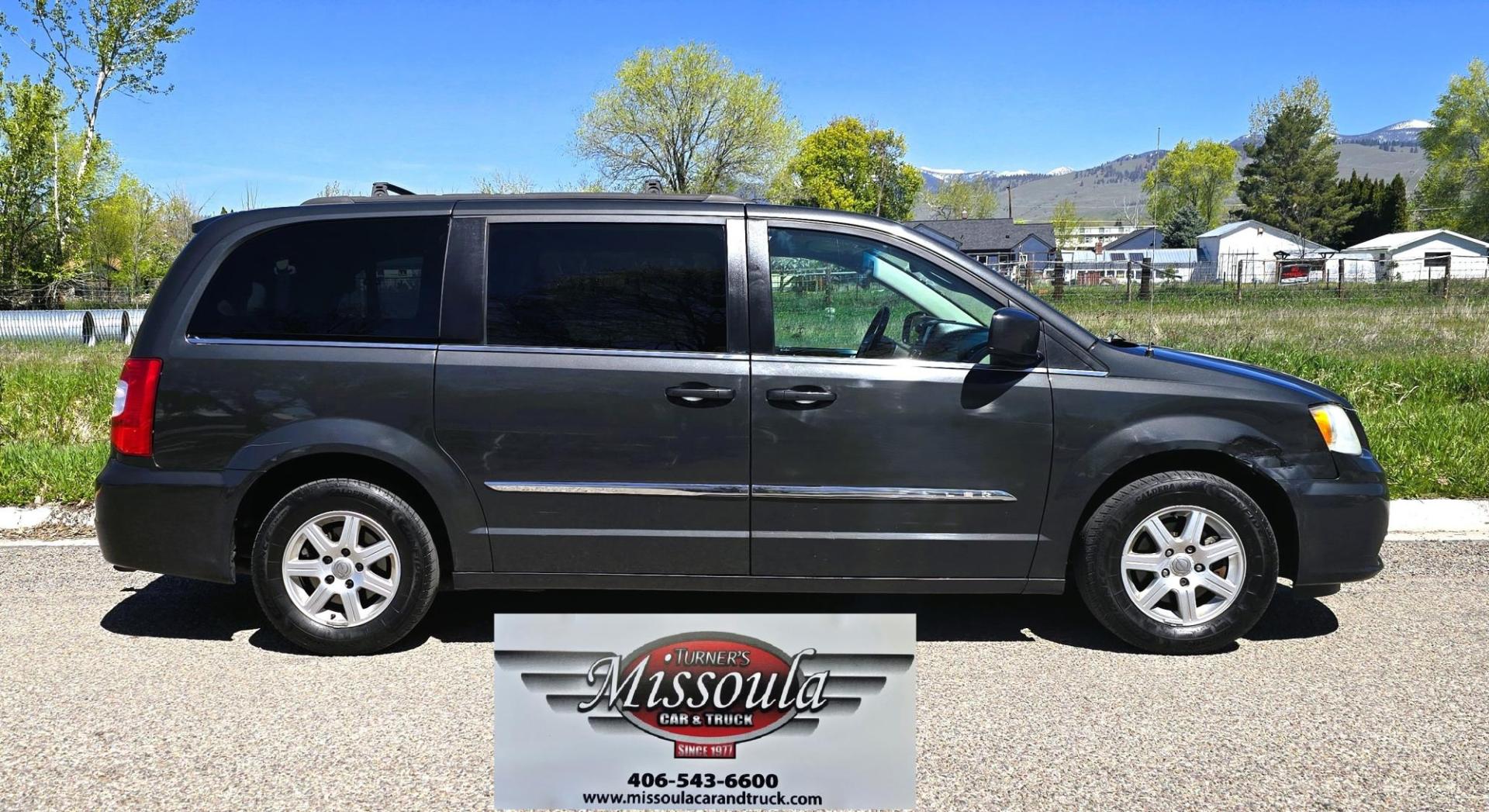 2012 Blue /Black Chrysler Town & Country Touring (2C4RC1BG5CR) with an 3.6L V6 DOHC 24V engine, 6-Speed Automatic transmission, located at 450 N Russell, Missoula, MT, 59801, (406) 543-6600, 46.874496, -114.017433 - Excellent Running Mini-Van. Zippy 3.6L V6 Engine. 6 Speed Automatic Transmission. 3rd Row Seating. Air. Cruise. Tilt. Power Windows and Locks. Rear Entertainment. Power Sliding Doors. Power Drivers Seat. AM FM SAT Touch Screen.Bluetooth Audio and Phone. Backup Camera. One small dent in the right fro - Photo#0