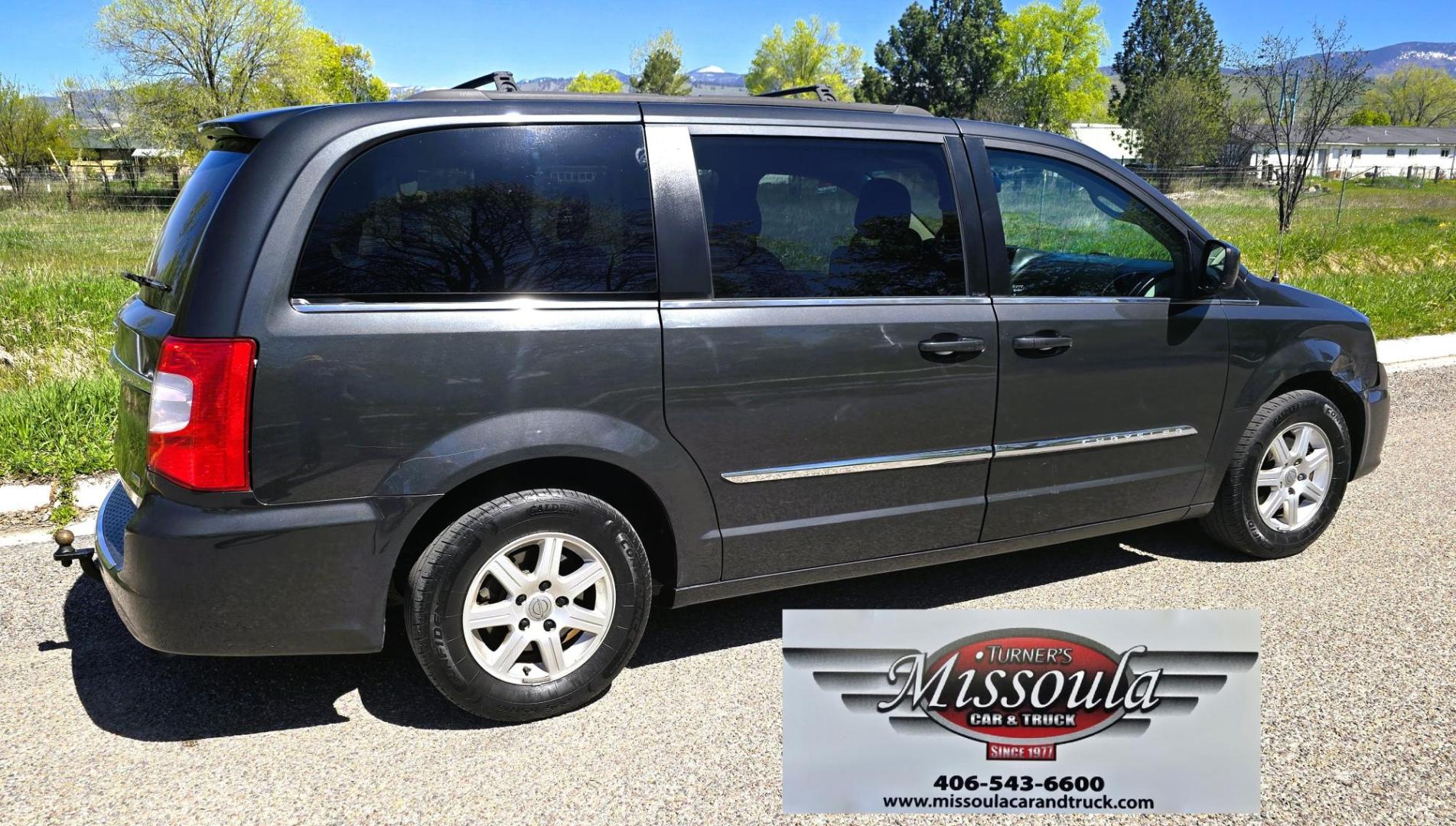 2012 Blue /Black Chrysler Town & Country Touring (2C4RC1BG5CR) with an 3.6L V6 DOHC 24V engine, 6-Speed Automatic transmission, located at 450 N Russell, Missoula, MT, 59801, (406) 543-6600, 46.874496, -114.017433 - Excellent Running Mini-Van. Zippy 3.6L V6 Engine. 6 Speed Automatic Transmission. 3rd Row Seating. Air. Cruise. Tilt. Power Windows and Locks. Rear Entertainment. Power Sliding Doors. Power Drivers Seat. AM FM SAT Touch Screen.Bluetooth Audio and Phone. Backup Camera. One small dent in the right fro - Photo#2