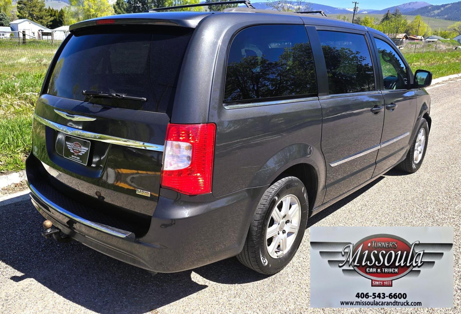 2012 Blue /Black Chrysler Town & Country Touring (2C4RC1BG5CR) with an 3.6L V6 DOHC 24V engine, 6-Speed Automatic transmission, located at 450 N Russell, Missoula, MT, 59801, (406) 543-6600, 46.874496, -114.017433 - Excellent Running Mini-Van. Zippy 3.6L V6 Engine. 6 Speed Automatic Transmission. 3rd Row Seating. Air. Cruise. Tilt. Power Windows and Locks. Rear Entertainment. Power Sliding Doors. Power Drivers Seat. AM FM SAT Touch Screen.Bluetooth Audio and Phone. Backup Camera. One small dent in the right fro - Photo#3