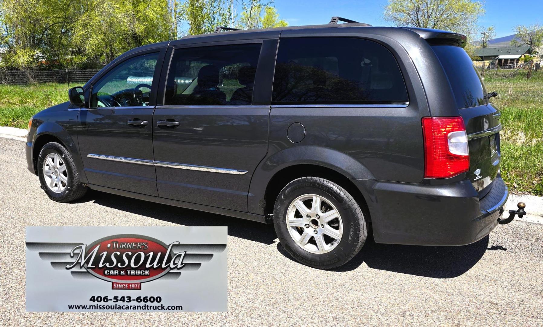 2012 Blue /Black Chrysler Town & Country Touring (2C4RC1BG5CR) with an 3.6L V6 DOHC 24V engine, 6-Speed Automatic transmission, located at 450 N Russell, Missoula, MT, 59801, (406) 543-6600, 46.874496, -114.017433 - Excellent Running Mini-Van. Zippy 3.6L V6 Engine. 6 Speed Automatic Transmission. 3rd Row Seating. Air. Cruise. Tilt. Power Windows and Locks. Rear Entertainment. Power Sliding Doors. Power Drivers Seat. AM FM SAT Touch Screen.Bluetooth Audio and Phone. Backup Camera. One small dent in the right fro - Photo#6