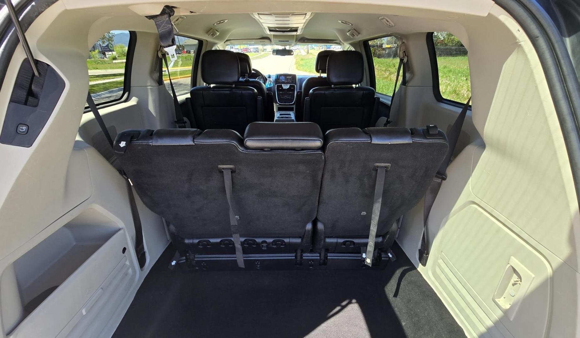 2012 Blue /Black Chrysler Town & Country Touring (2C4RC1BG5CR) with an 3.6L V6 DOHC 24V engine, 6-Speed Automatic transmission, located at 450 N Russell, Missoula, MT, 59801, (406) 543-6600, 46.874496, -114.017433 - Excellent Running Mini-Van. Zippy 3.6L V6 Engine. 6 Speed Automatic Transmission. 3rd Row Seating. Air. Cruise. Tilt. Power Windows and Locks. Rear Entertainment. Power Sliding Doors. Power Drivers Seat. AM FM SAT Touch Screen.Bluetooth Audio and Phone. Backup Camera. One small dent in the right fro - Photo#10