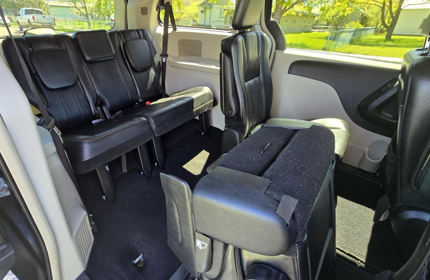 2012 Blue /Black Chrysler Town & Country Touring (2C4RC1BG5CR) with an 3.6L V6 DOHC 24V engine, 6-Speed Automatic transmission, located at 450 N Russell, Missoula, MT, 59801, (406) 543-6600, 46.874496, -114.017433 - Excellent Running Mini-Van. Zippy 3.6L V6 Engine. 6 Speed Automatic Transmission. 3rd Row Seating. Air. Cruise. Tilt. Power Windows and Locks. Rear Entertainment. Power Sliding Doors. Power Drivers Seat. AM FM SAT Touch Screen.Bluetooth Audio and Phone. Backup Camera. One small dent in the right fro - Photo#12