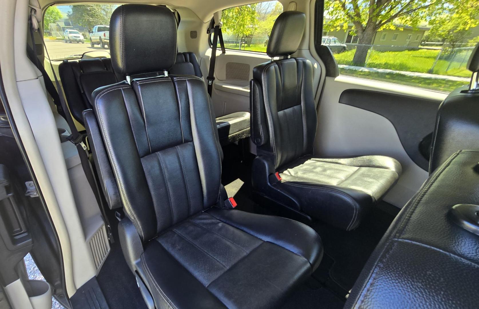 2012 Blue /Black Chrysler Town & Country Touring (2C4RC1BG5CR) with an 3.6L V6 DOHC 24V engine, 6-Speed Automatic transmission, located at 450 N Russell, Missoula, MT, 59801, (406) 543-6600, 46.874496, -114.017433 - Excellent Running Mini-Van. Zippy 3.6L V6 Engine. 6 Speed Automatic Transmission. 3rd Row Seating. Air. Cruise. Tilt. Power Windows and Locks. Rear Entertainment. Power Sliding Doors. Power Drivers Seat. AM FM SAT Touch Screen.Bluetooth Audio and Phone. Backup Camera. One small dent in the right fro - Photo#11