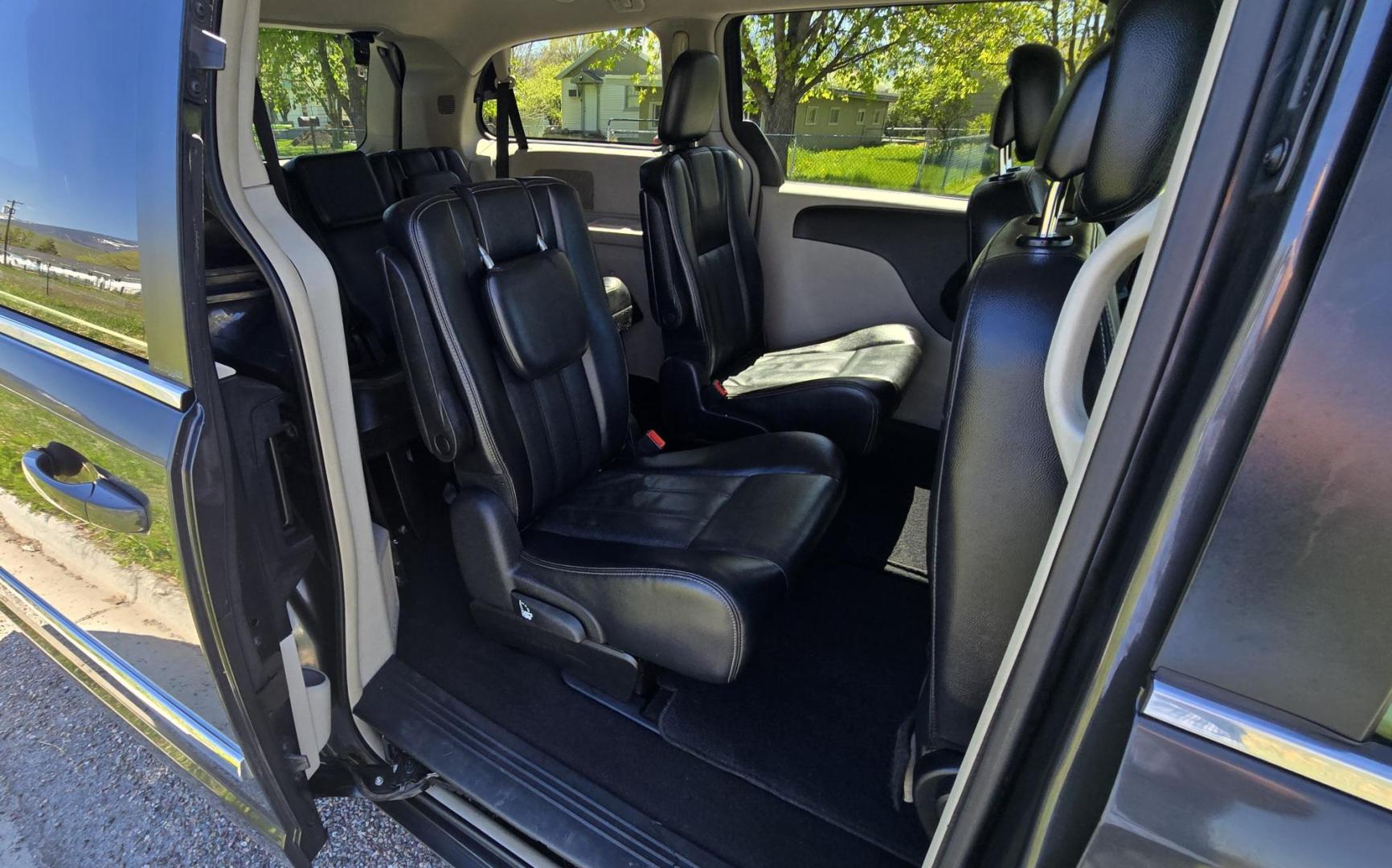 2012 Blue /Black Chrysler Town & Country Touring (2C4RC1BG5CR) with an 3.6L V6 DOHC 24V engine, 6-Speed Automatic transmission, located at 450 N Russell, Missoula, MT, 59801, (406) 543-6600, 46.874496, -114.017433 - Excellent Running Mini-Van. Zippy 3.6L V6 Engine. 6 Speed Automatic Transmission. 3rd Row Seating. Air. Cruise. Tilt. Power Windows and Locks. Rear Entertainment. Power Sliding Doors. Power Drivers Seat. AM FM SAT Touch Screen.Bluetooth Audio and Phone. Backup Camera. One small dent in the right fro - Photo#13