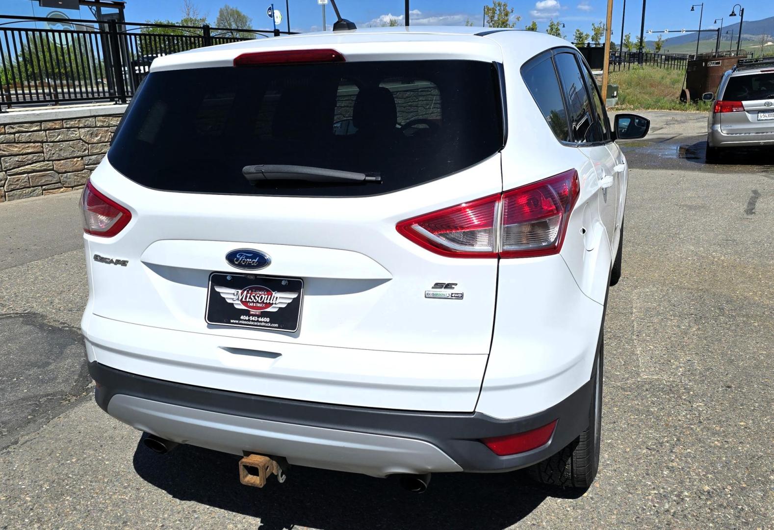 2016 White /Black Ford Escape SE AWD (1FMCU9G92GU) with an 2.0L L4 DOHC 16V engine, 6-Speed Automatic transmission, located at 450 N Russell, Missoula, MT, 59801, (406) 543-6600, 46.874496, -114.017433 - Inexpensive AWD SUV. 2.0L I4 Engine. Automatic Transmission. Air Conditioning. Cruise Control. Tilt Steering. Backup Camera. AM FM CD Player. Bluetooth Audio and Phone Connection. Tires are Excellent. We Finance through local Credit Unions. We do NOT offer In House (Buy Here Pay Here) Financing. - Photo#4