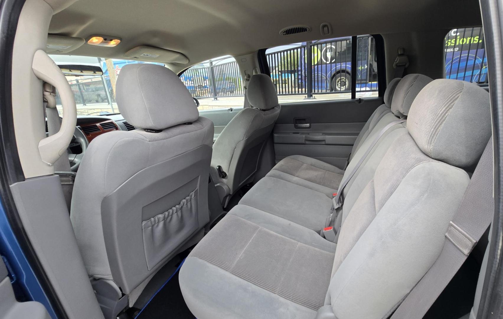 2005 Blue /Gray Dodge Durango Adventurer Model 2WD (1D4HD48D95F) with an 5.7L V8 OHV 16V engine, 5-Speed Automatic Overdrive transmission, located at 450 N Russell, Missoula, MT, 59801, (406) 543-6600, 46.874496, -114.017433 - Yup, It's got a Hemi! Roomy Rear Wheel Drive SUV with 3rd Row Seating. Air Conditioning was just serviced. Cruise Control. Power Windows and Locks. AM FM CD Player. Like New BF Goodrich Tires. Does have a small blemish on the left rear quarter panel. Clean Title and Carfax. Because of the age, ou - Photo#14
