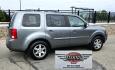 2009 Grey /Black Honda Pilot Touring 4WD (5FNYF48819B) with an 3.5L V6 SOHC 24V engine, 5-Speed Automatic transmission, located at 450 N Russell, Missoula, MT, 59801, (406) 543-6600, 46.874496, -114.017433 - 2 Owner Honda AWD SUV. 3.5L V6 Engine. Automatic Transmission. 3rd Row Seating. Heated Power Front Seats. Power Sunroof. AM FM CD Player. Air. Cruise. Tilt. Bluetooth Phone Connection. Power Liftgate. New Tires. Catalytic converter replaced 30K miles ago. We Finance through local Credit Unions. - Photo#6