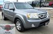 2009 Grey /Black Honda Pilot Touring 4WD (5FNYF48819B) with an 3.5L V6 SOHC 24V engine, 5-Speed Automatic transmission, located at 450 N Russell, Missoula, MT, 59801, (406) 543-6600, 46.874496, -114.017433 - 2 Owner Honda AWD SUV. 3.5L V6 Engine. Automatic Transmission. 3rd Row Seating. Heated Power Front Seats. Power Sunroof. AM FM CD Player. Air. Cruise. Tilt. Bluetooth Phone Connection. Power Liftgate. New Tires. Catalytic converter replaced 30K miles ago. We Finance through local Credit Unions. - Photo#8