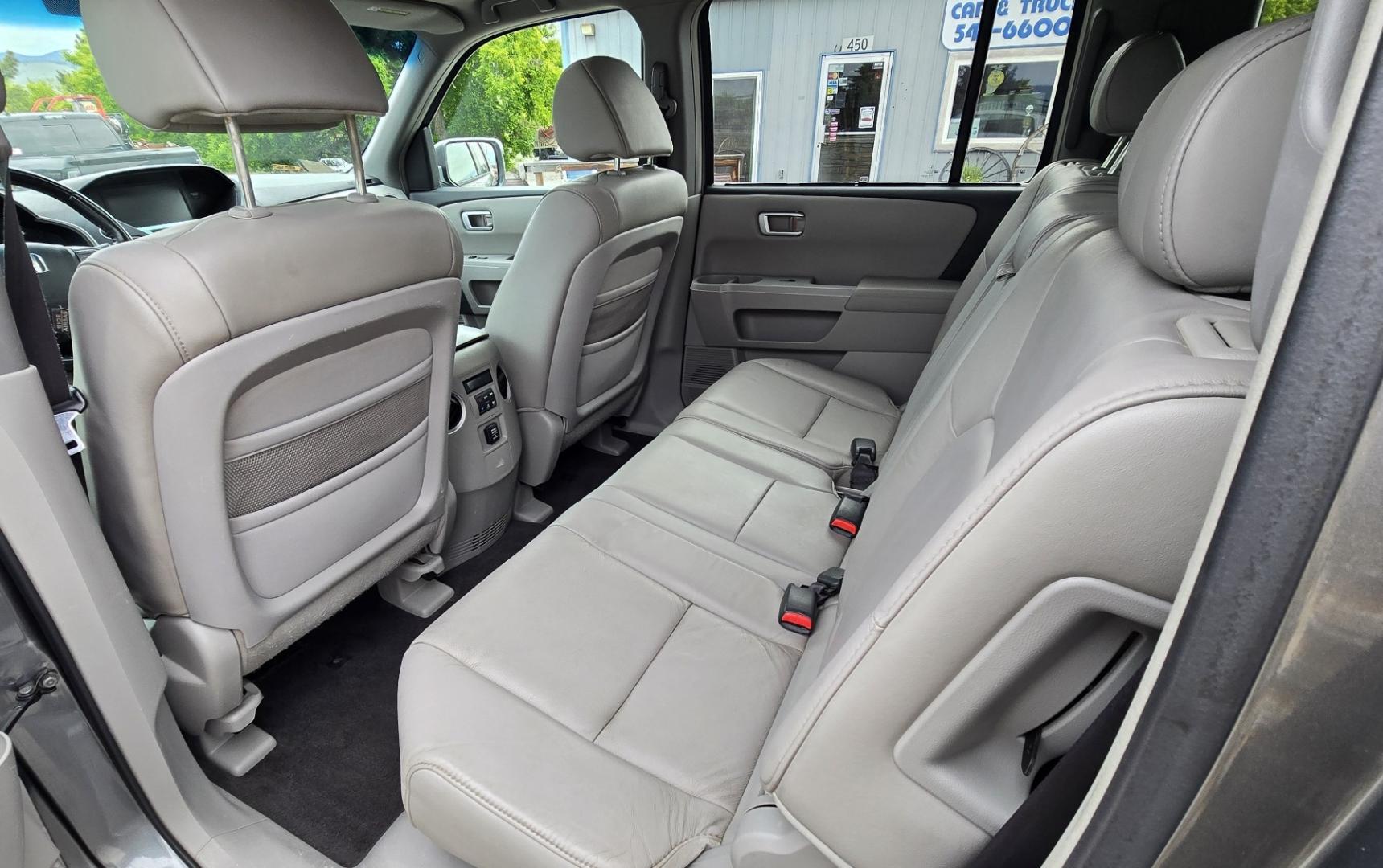 2009 Grey /Black Honda Pilot Touring 4WD (5FNYF48819B) with an 3.5L V6 SOHC 24V engine, 5-Speed Automatic transmission, located at 450 N Russell, Missoula, MT, 59801, (406) 543-6600, 46.874496, -114.017433 - 2 Owner Honda AWD SUV. 3.5L V6 Engine. Automatic Transmission. 3rd Row Seating. Heated Power Front Seats. Power Sunroof. AM FM CD Player. Air. Cruise. Tilt. Bluetooth Phone Connection. Power Liftgate. New Tires. Catalytic converter replaced 30K miles ago. We Finance through local Credit Unions. - Photo#14