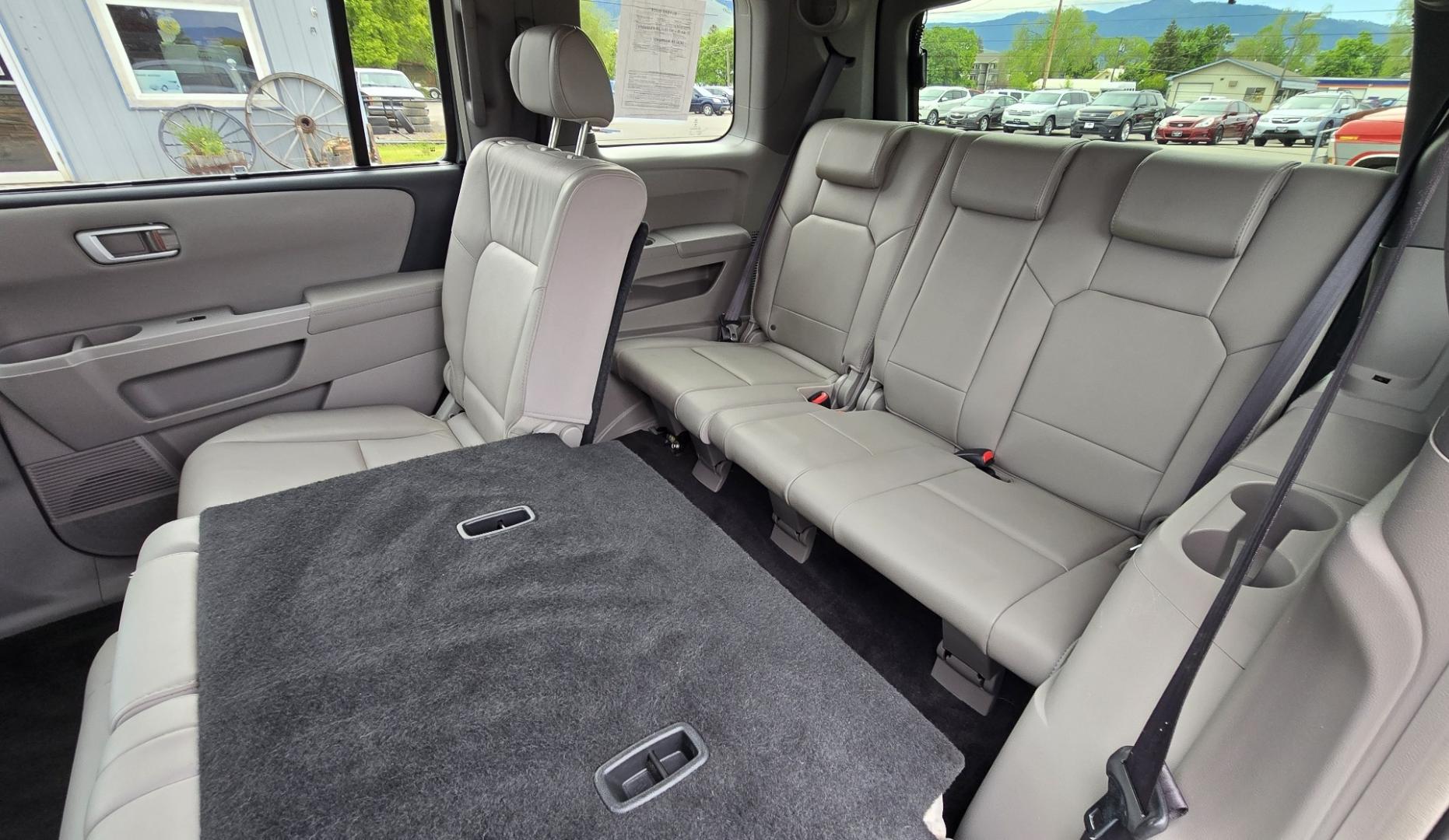 2009 Grey /Black Honda Pilot Touring 4WD (5FNYF48819B) with an 3.5L V6 SOHC 24V engine, 5-Speed Automatic transmission, located at 450 N Russell, Missoula, MT, 59801, (406) 543-6600, 46.874496, -114.017433 - 2 Owner Honda AWD SUV. 3.5L V6 Engine. Automatic Transmission. 3rd Row Seating. Heated Power Front Seats. Power Sunroof. AM FM CD Player. Air. Cruise. Tilt. Bluetooth Phone Connection. Power Liftgate. New Tires. Catalytic converter replaced 30K miles ago. We Finance through local Credit Unions. - Photo#15
