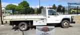 2000 White /Blue Chevrolet C/K 3500 Reg. Cab 2WD (1GBKC34J4YF) with an 7.4L V8 OHV 16V engine, Automatic transmission, located at 450 N Russell, Missoula, MT, 59801, (406) 543-6600, 46.874496, -114.017433 - Beefy One Ton Chevy Dually with the Powerful 7.4L V8 Engine. Automatic Transmission. Rear Wheel Drive. Massive Aluminum Flatbed measuring 8 Feet Wide by just under 12 feet long. Hydraulic Lift raises the Flatbed almost vertical. Air Conditioning. Blows Cold. AM FM Radio. Dual Gas Tanks. Not a lot of - Photo#1