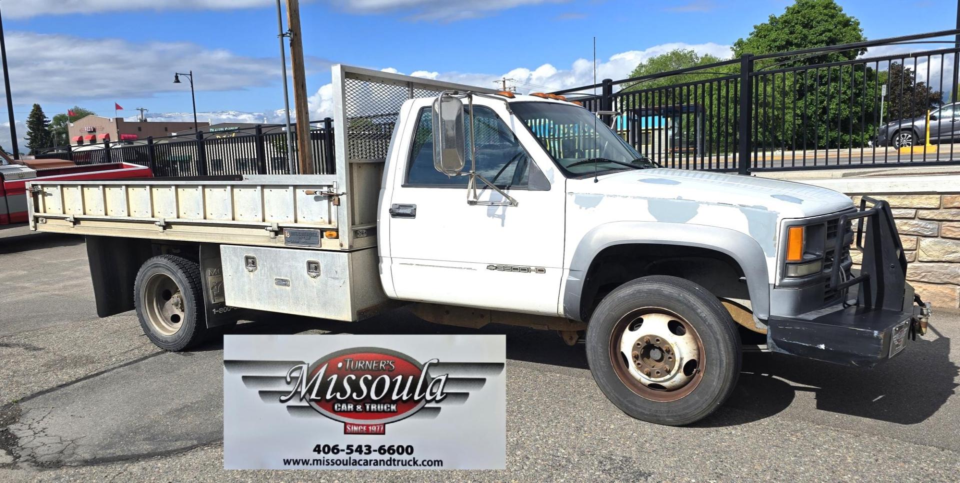 2000 White /Blue Chevrolet C/K 3500 Reg. Cab 2WD (1GBKC34J4YF) with an 7.4L V8 OHV 16V engine, Automatic transmission, located at 450 N Russell, Missoula, MT, 59801, (406) 543-6600, 46.874496, -114.017433 - Beefy One Ton Chevy Dually with the Powerful 7.4L V8 Engine. Automatic Transmission. Rear Wheel Drive. Massive Aluminum Flatbed measuring 8 Feet Wide by just under 12 feet long. Hydraulic Lift raises the Flatbed almost vertical. Air Conditioning. Blows Cold. AM FM Radio. Dual Gas Tanks. Not a lot of - Photo#2